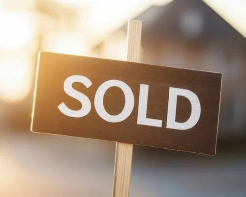 A sold sign posted in front of a single-family house successfully staged by Essential Home Staging in Issaquah, WA.