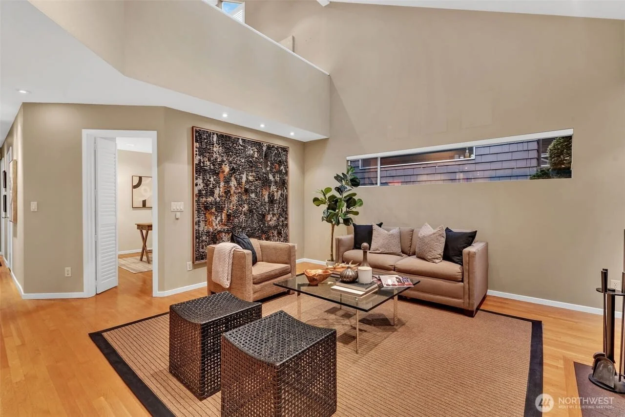 Deep neutral contemporary living room staging by Essential Home Staging in Bellevue, WA.