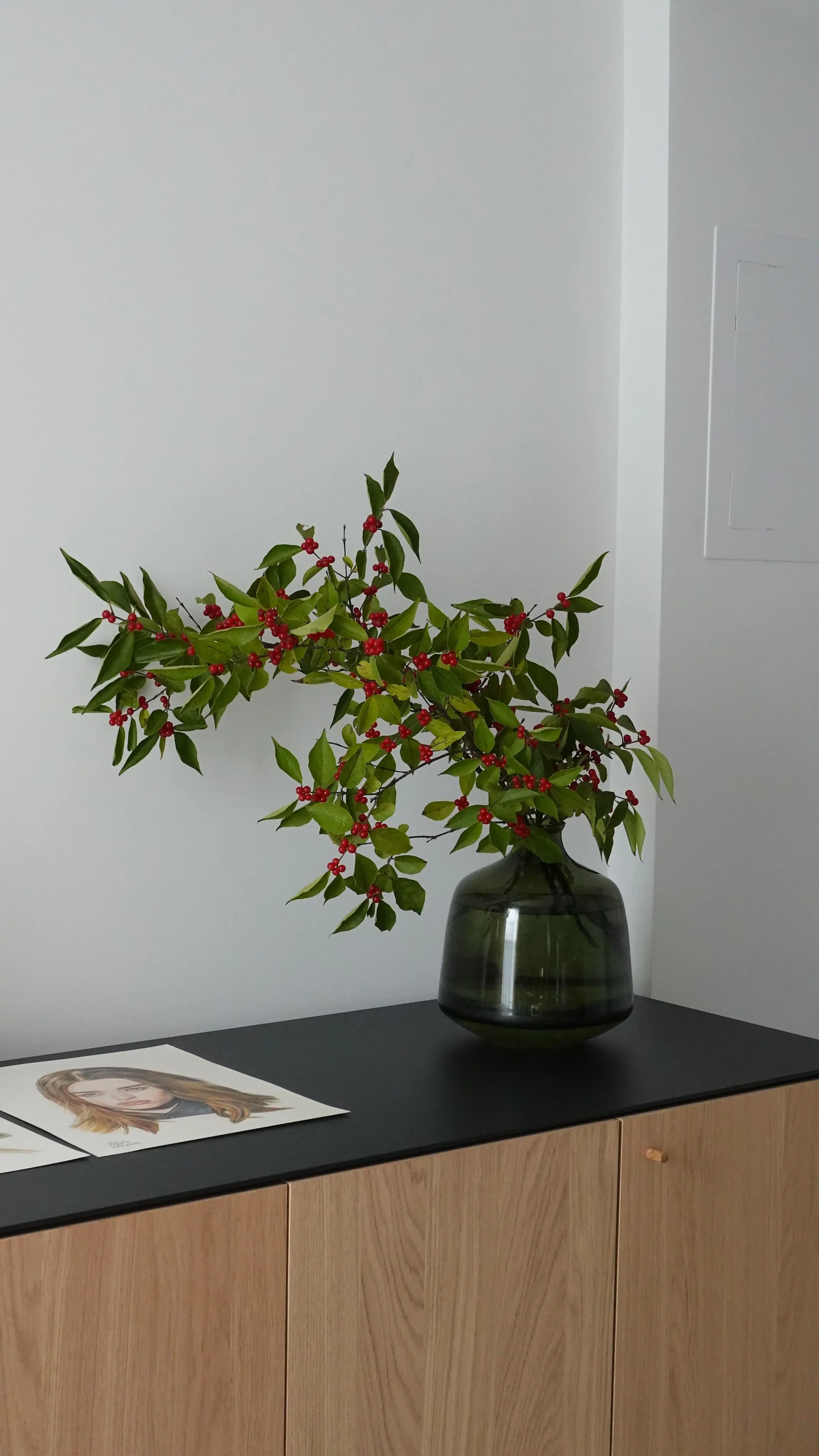 Staged console table vignette with modern inspired décor accents in West Seattle.