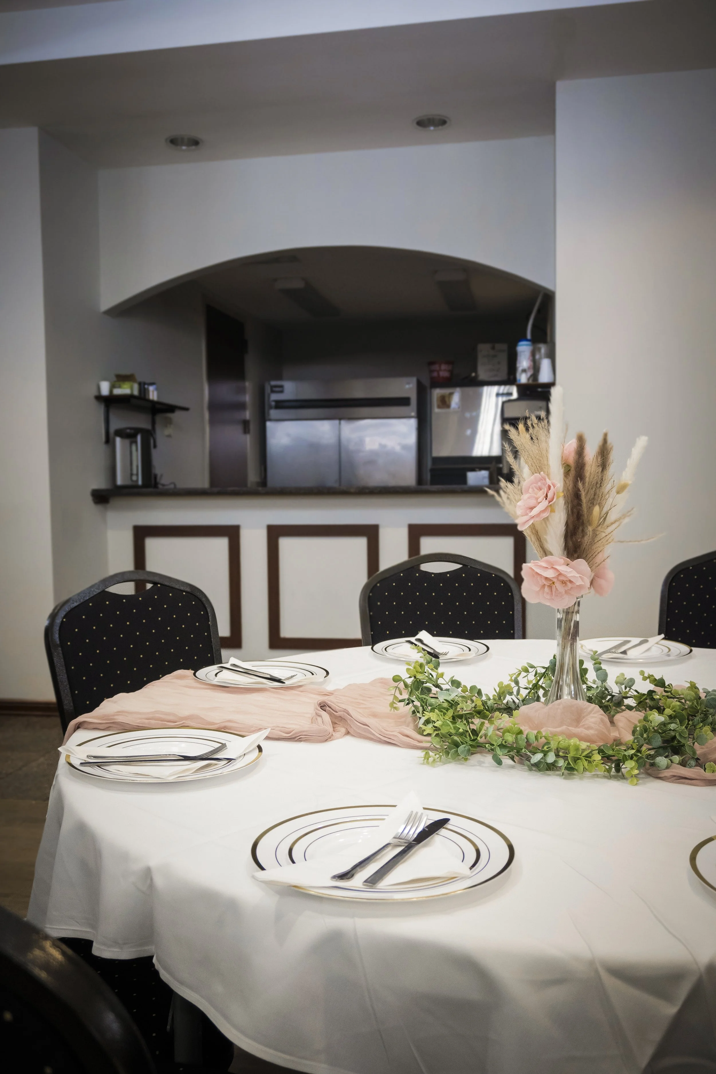 Banquet table with a view of the kitchen in the banquet room at the Macedonian Church in Reynoldsburg Ohio prior to an event