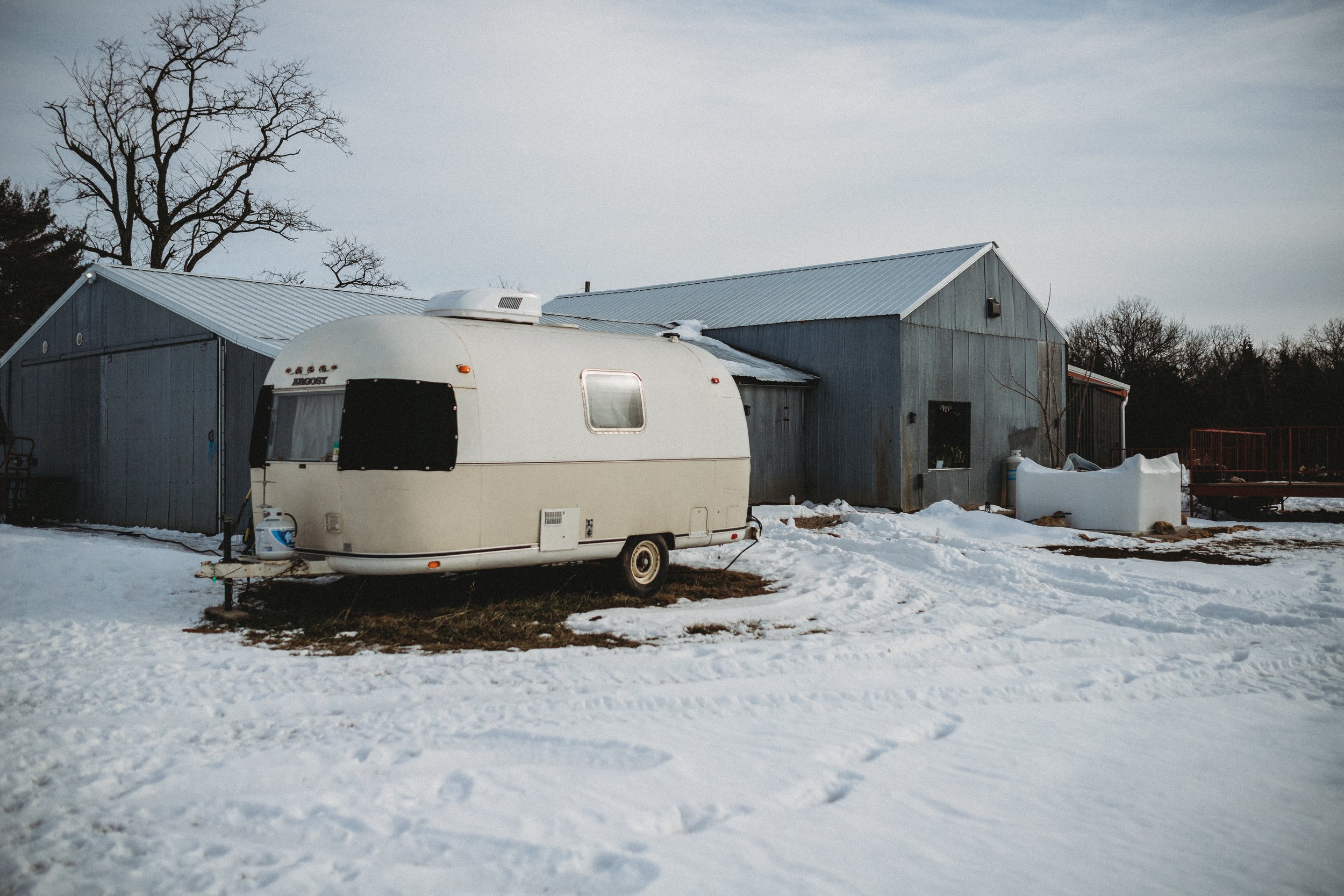 Winter Wedding with retro trailer Burning Barrel