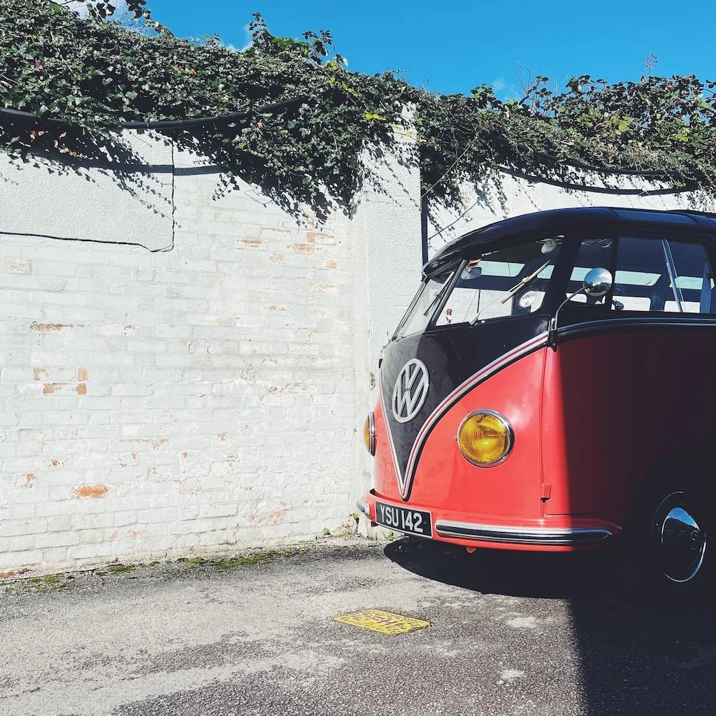 Red and black VW Splitscreen Bus