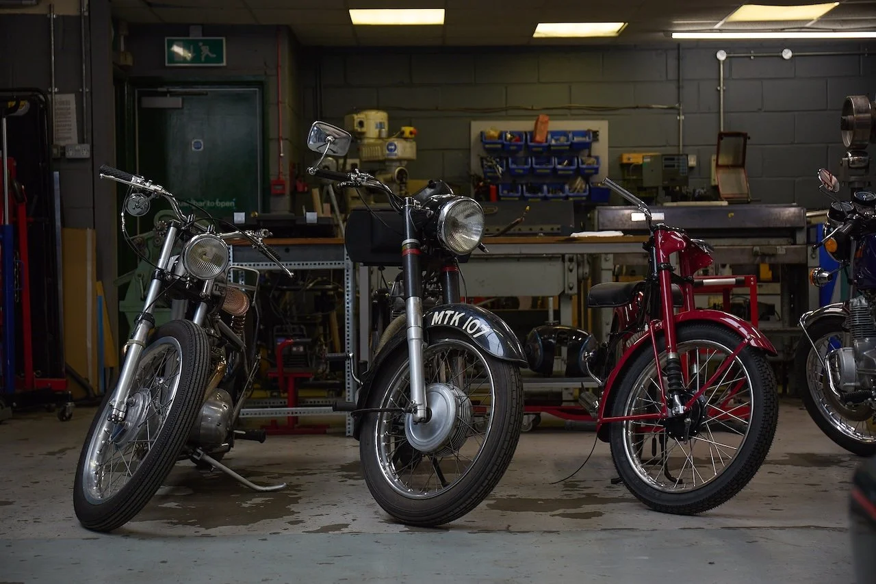 classic british motorcycles being repaired in  Bristol workshop