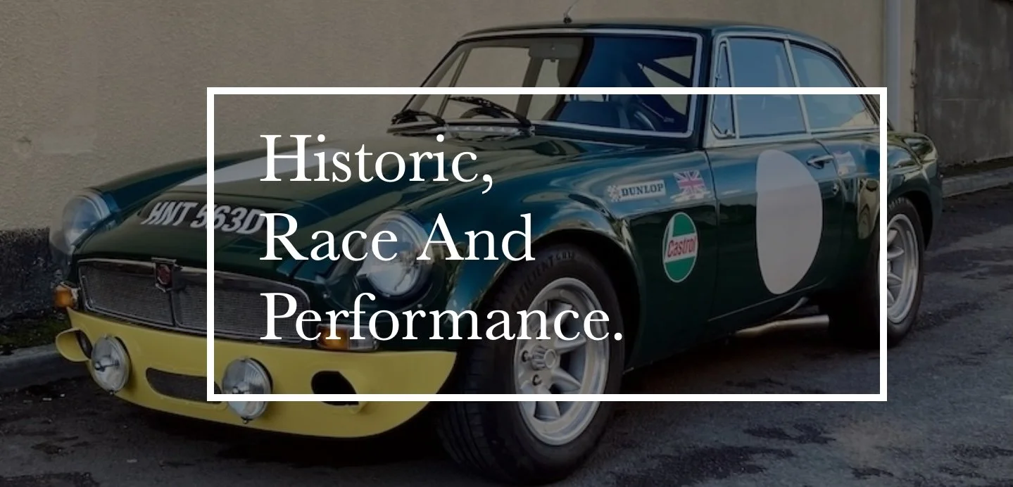 classic mgb race car in green and yellow