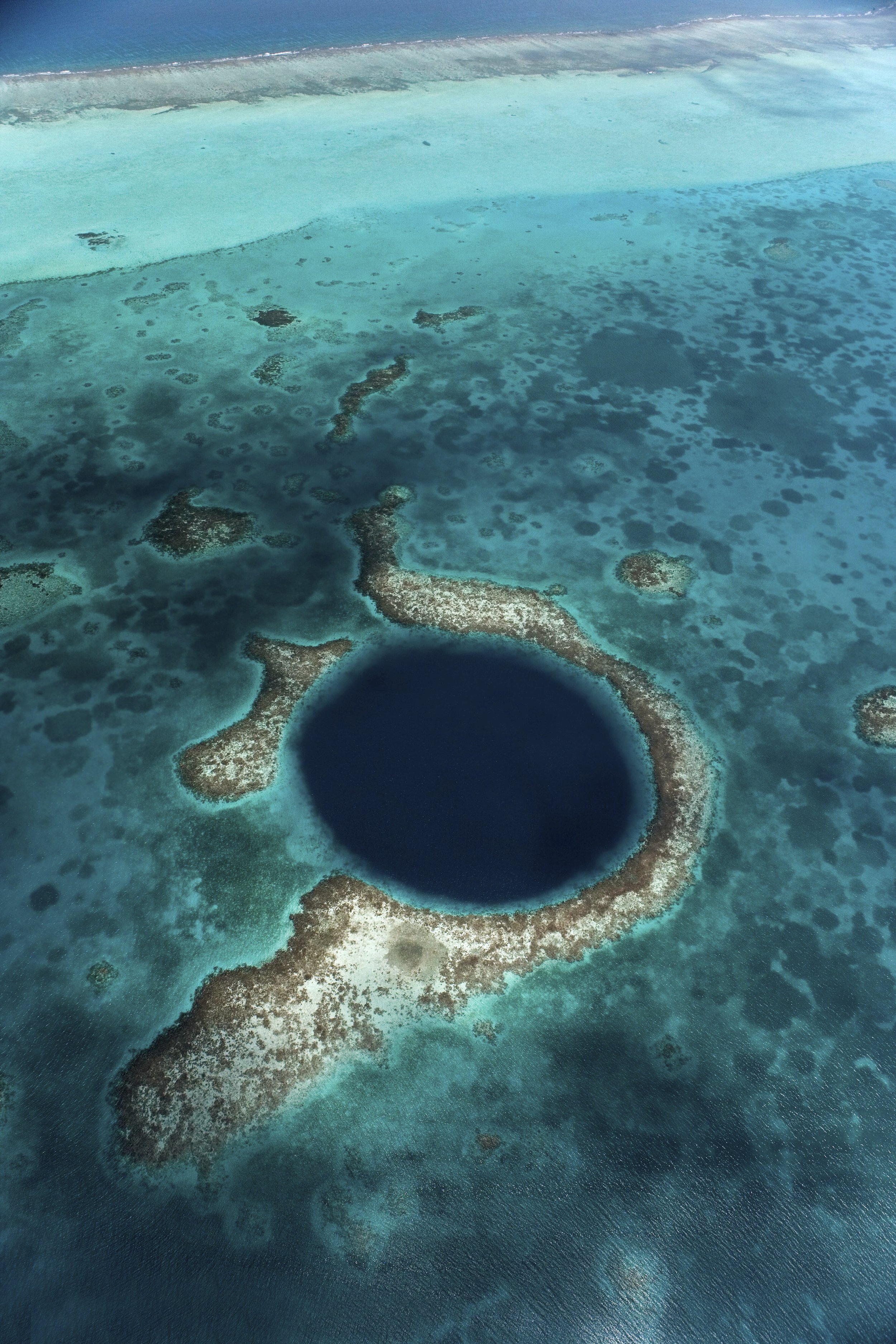 Coral reef barrier in Central America with clear turquoise water, vibrant marine ecosystem, and tropical coastal scenery.