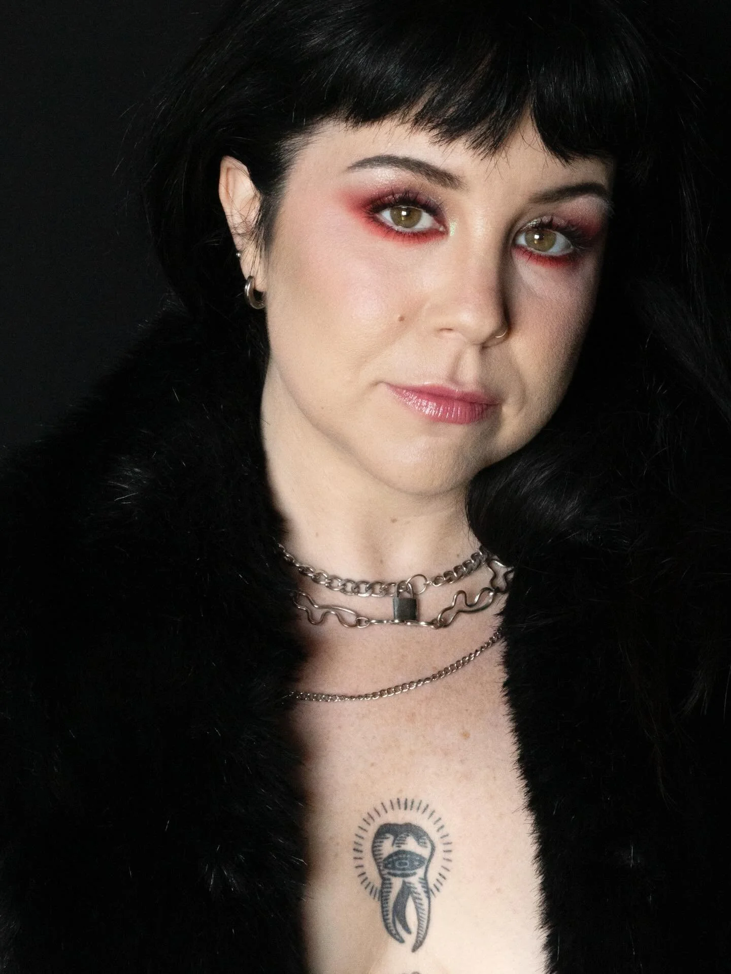 Bold color and fun textures for my friend, Tenea.. I originally wanted to do a pearl or silver look on her but once she sat down and I really looked at her features I knew this was the direction I wanted to go. The pop of scarlet red against her skin