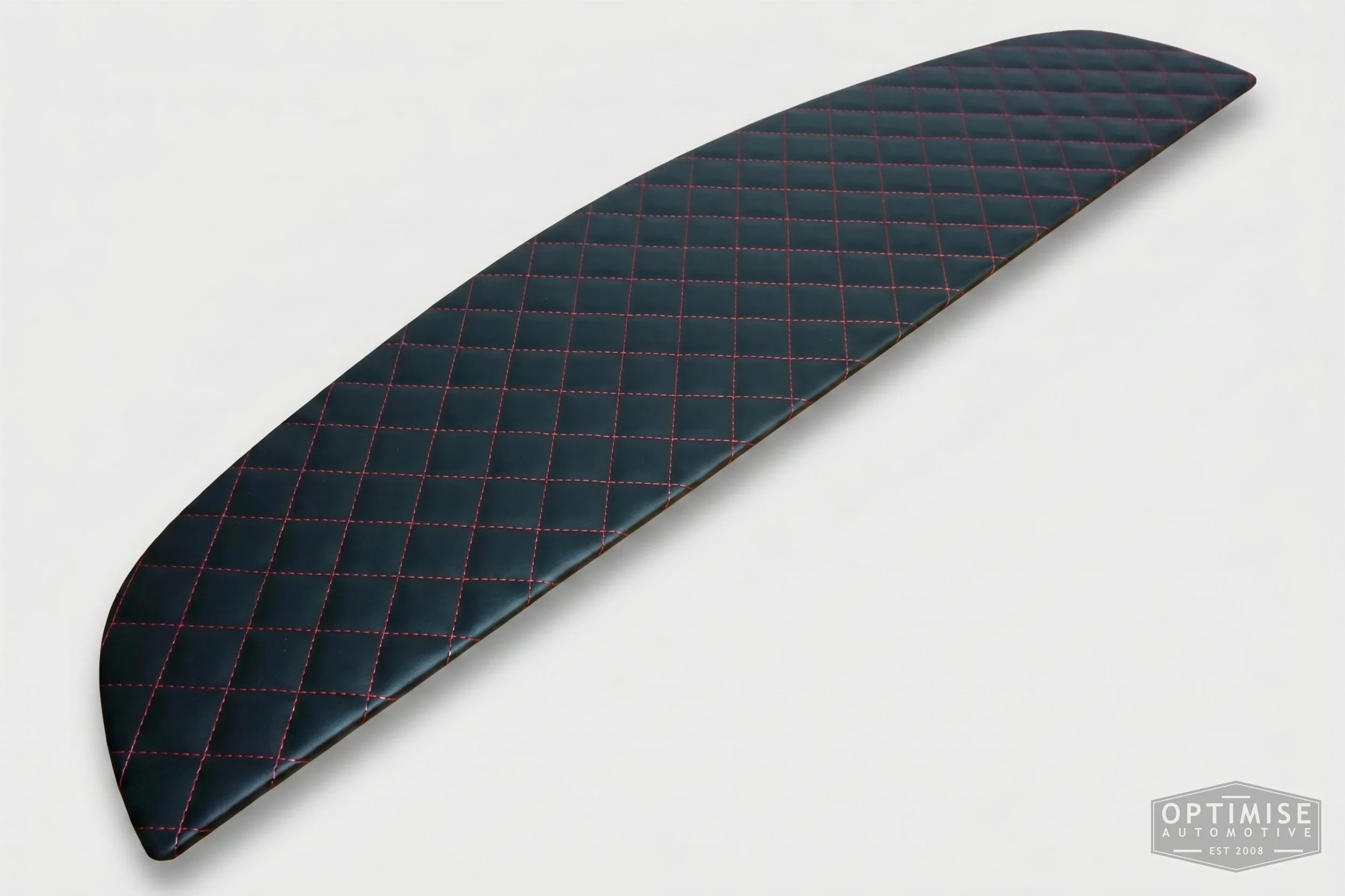 Classic Mini parcel shelf board, trimmed in black vinyl leatherette with red diamond stitching.