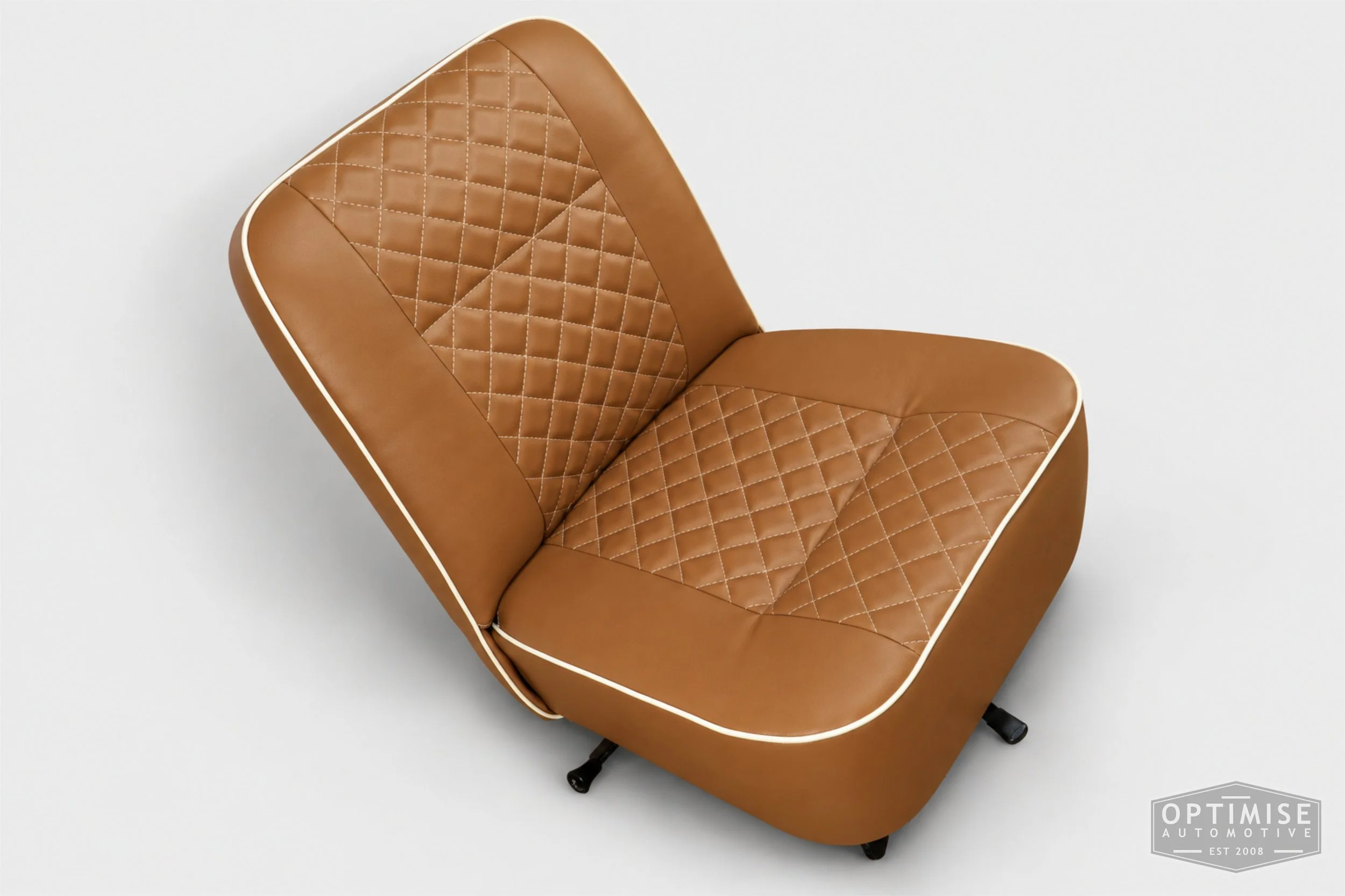 Classic Mini seat retrims featuring original early MK3 vertical-leg non-reclining front seats and a matching early MK3 rear seat, trimmed in tan leatherette with cream diamond stitching and piping.