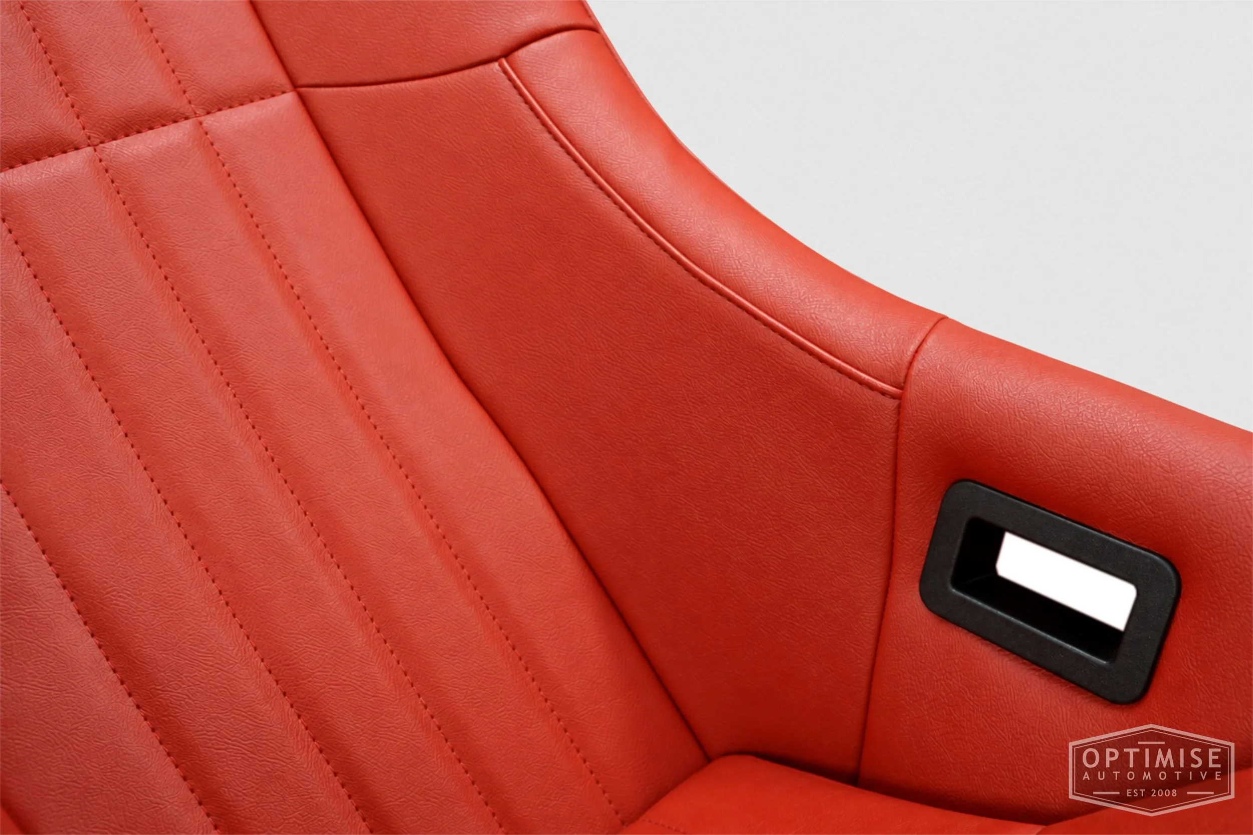 Classic Mini seat retrims featuring Cobra Clubman front seats, trimmed in red tartan leatherette to complement the original MK1 interior.