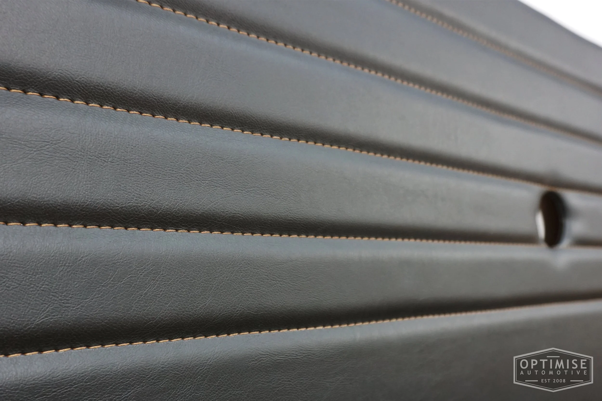 Classic Mini Monte-Carlo door cards, trimmed in black vinyl leatherette with light brown stitching.