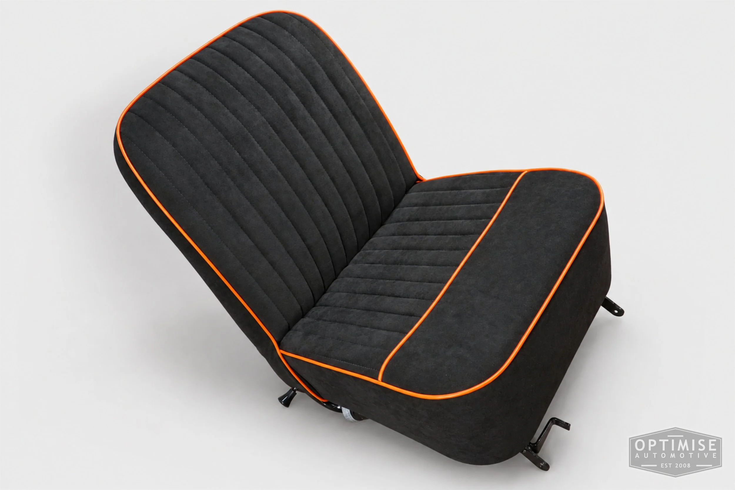 Classic Mini Van seat retrims featuring original non-reclining front seats, trimmed in black Alcantara with orange piping.