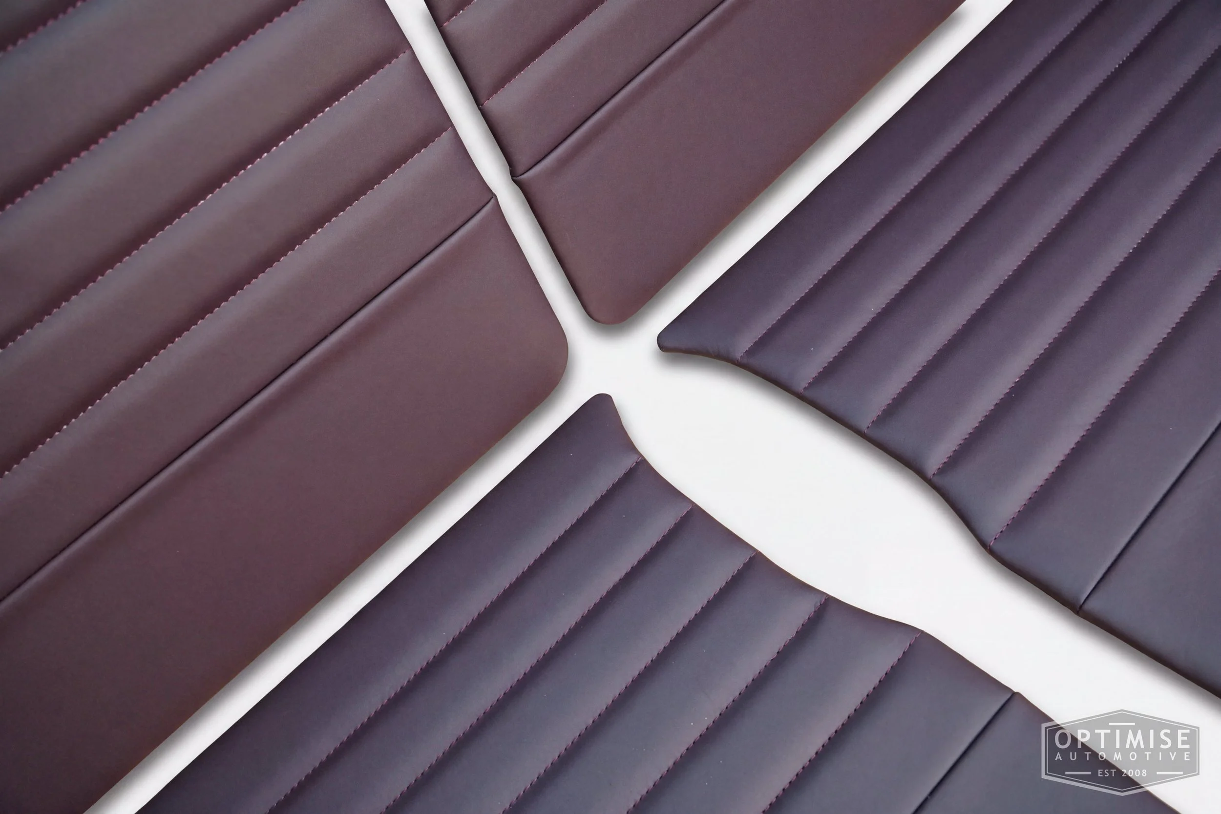 Classic Mini Monte-Carlo Plus door cards, trimmed in aubergine leather with aubergine stitching and no piping.