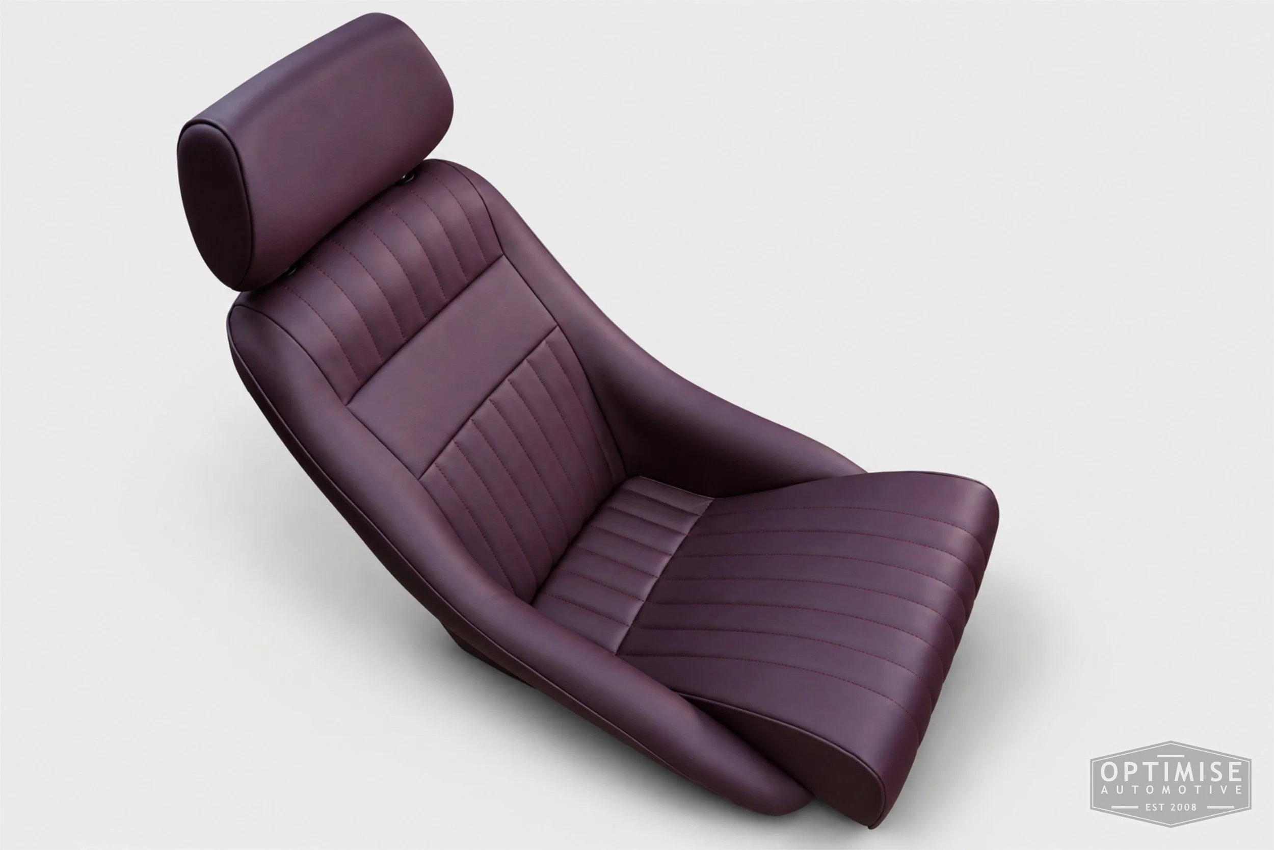 Classic Mini seat retrims featuring Cobra Monte Carlo front seats, trimmed in Caledonian aubergine leather.