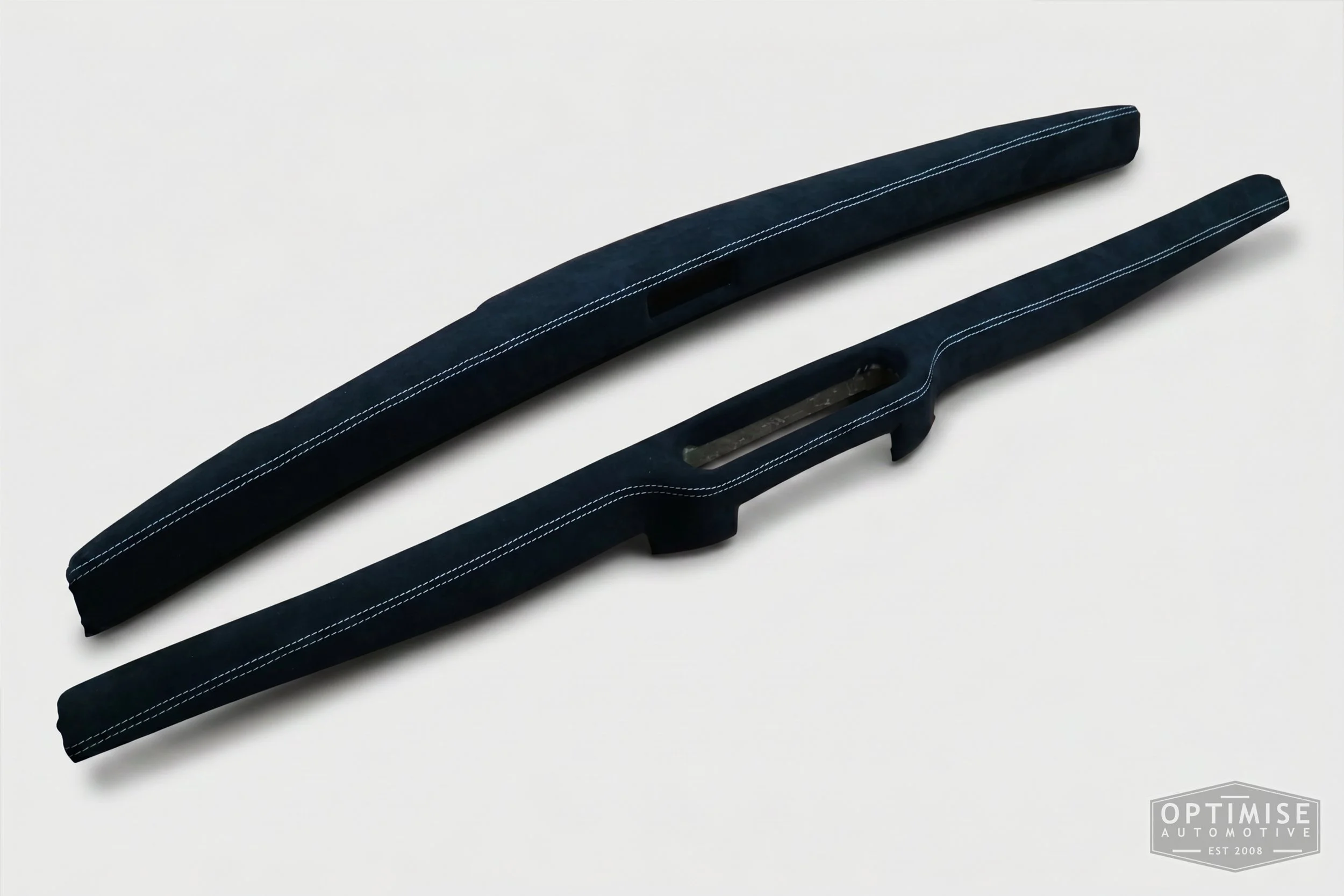Classic Mini dash rail retrims, trimmed in black Alcantara with off-white stitching.