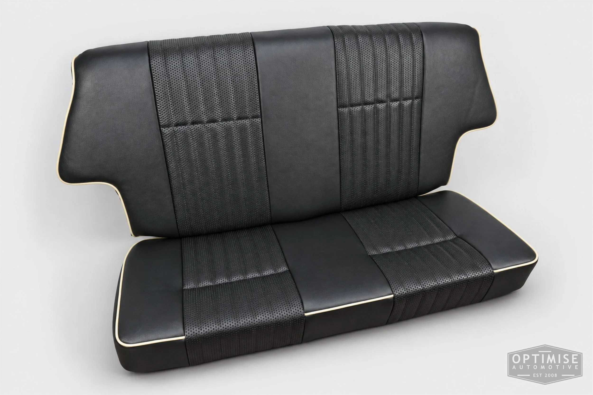 Classic Mini seat retrims featuring original MPi front seats and a matching rear seat, trimmed in black leatherette and black basketweave with cream piping.