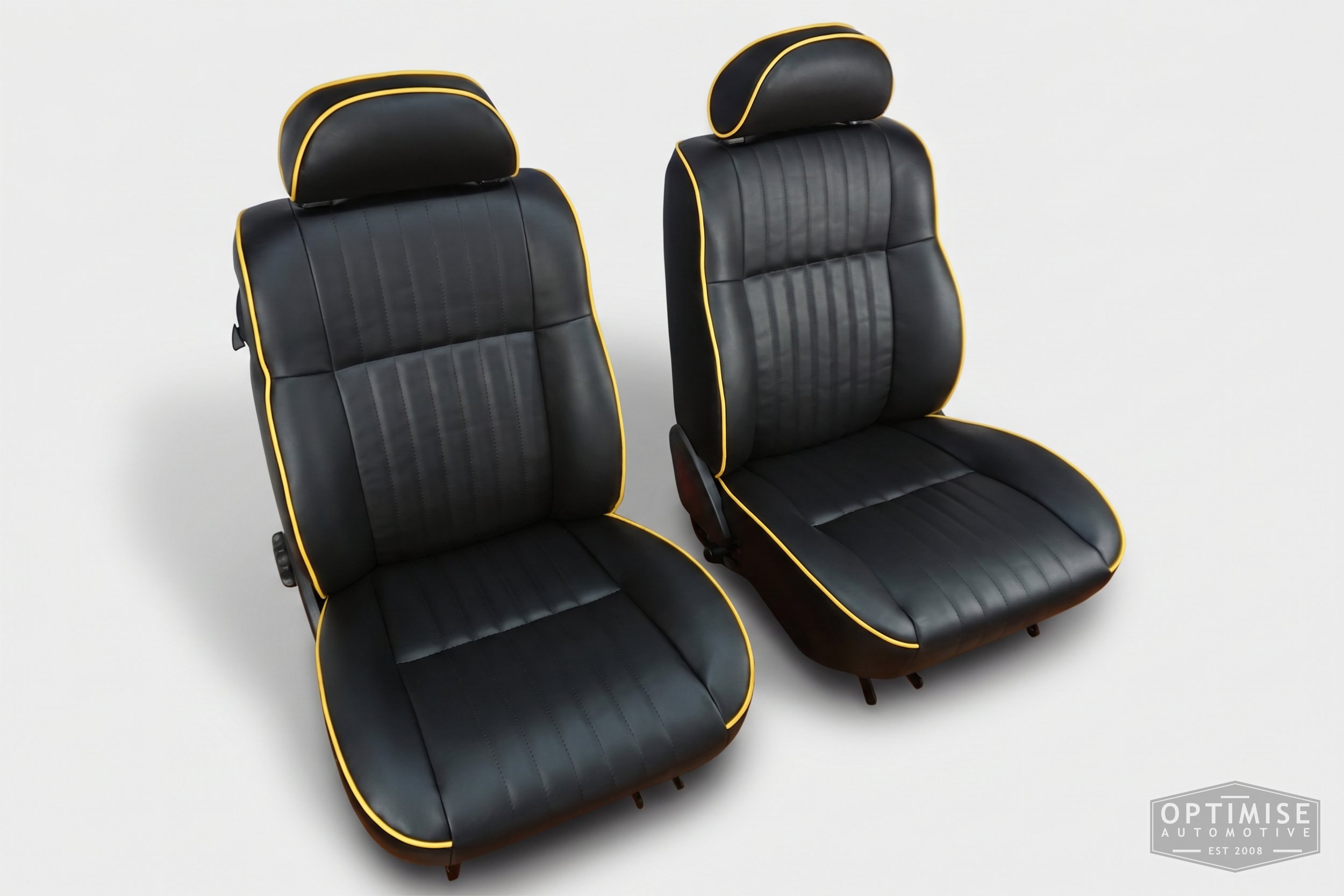 Classic Mini SPi seat retrims, trimmed in black leatherette with yellow piping and stitching.