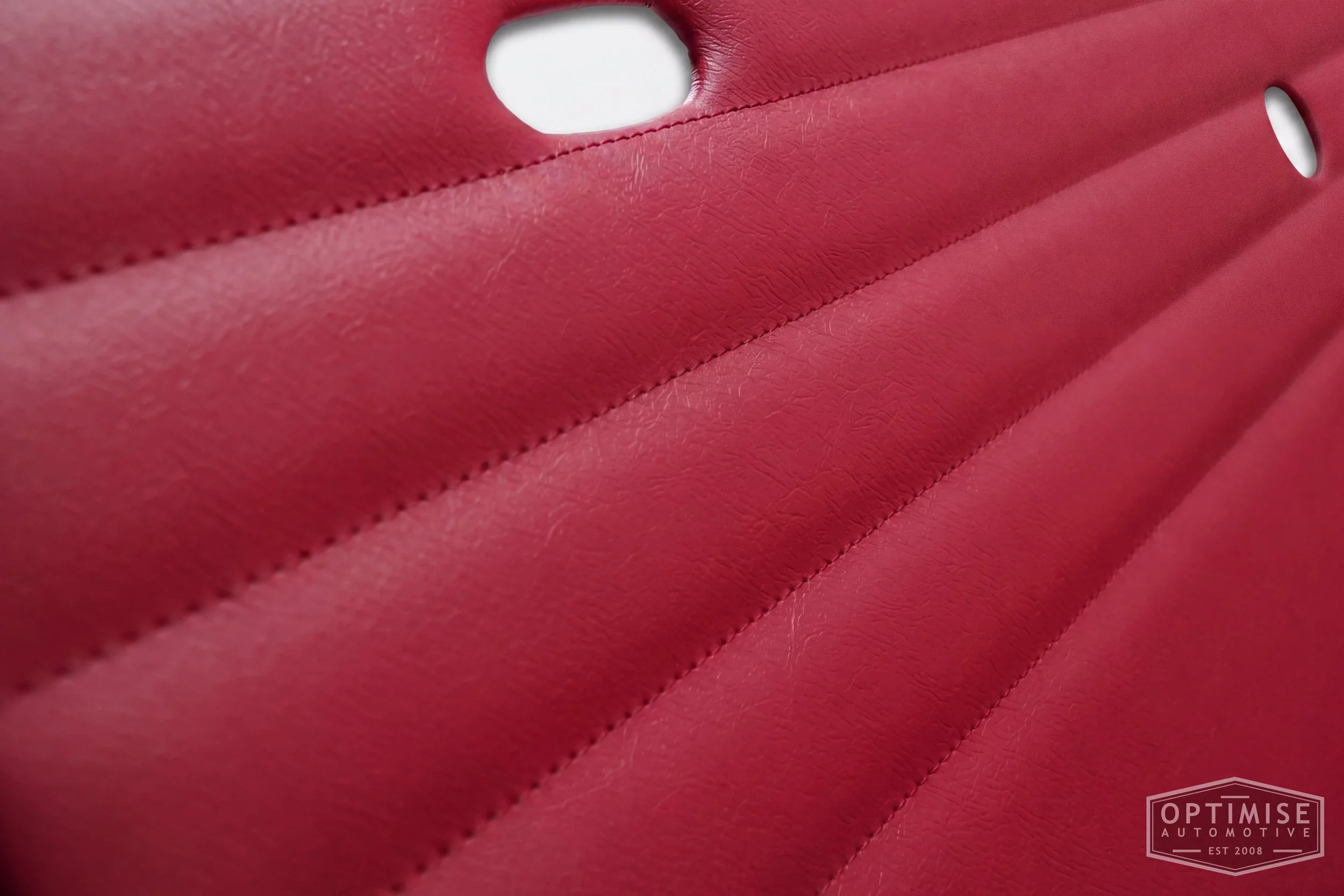 Classic Mini Monte-Carlo door cards, trimmed in burgundy vinyl leatherette with burgundy stitching.