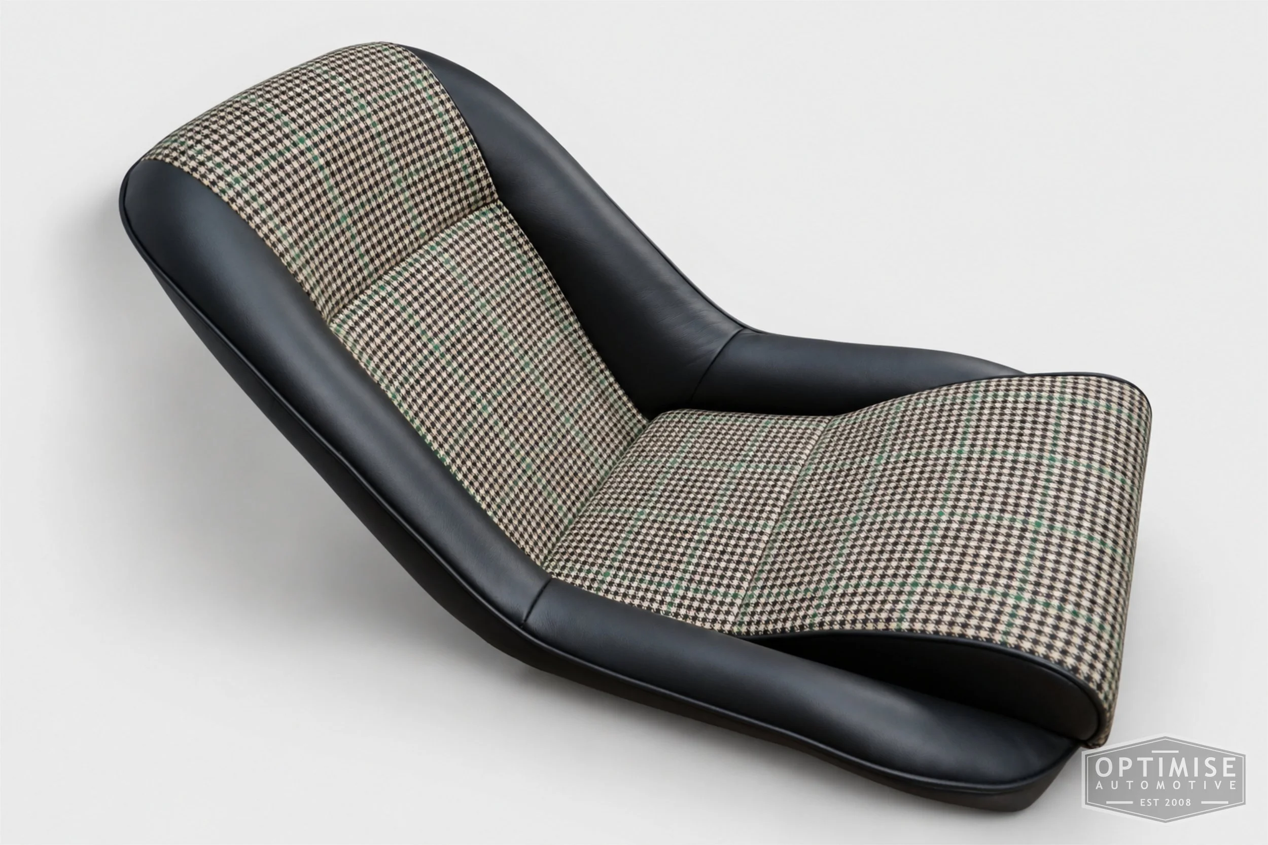 Classic Mini seat retrims featuring Cobra Cub front seats and a matching SPi rear seat, trimmed in Hampton Check Tweed 054 and Crest Vele black leather.