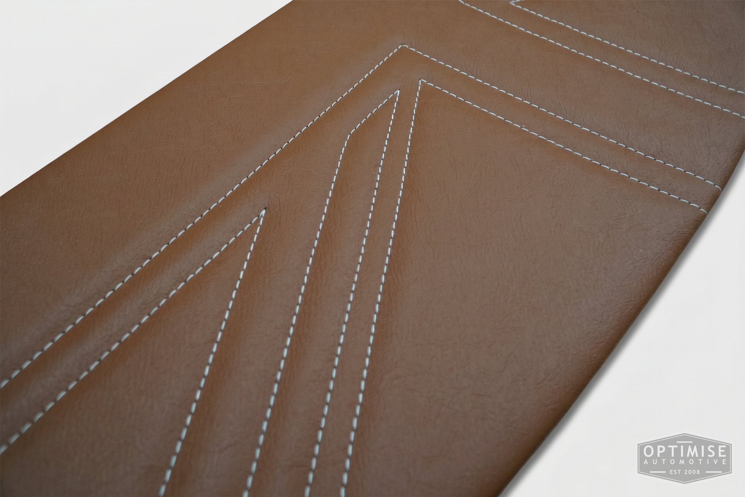 Classic Mini Union Jack parcel shelf board, trimmed in light brown (tan) vinyl leatherette with cream stitching.