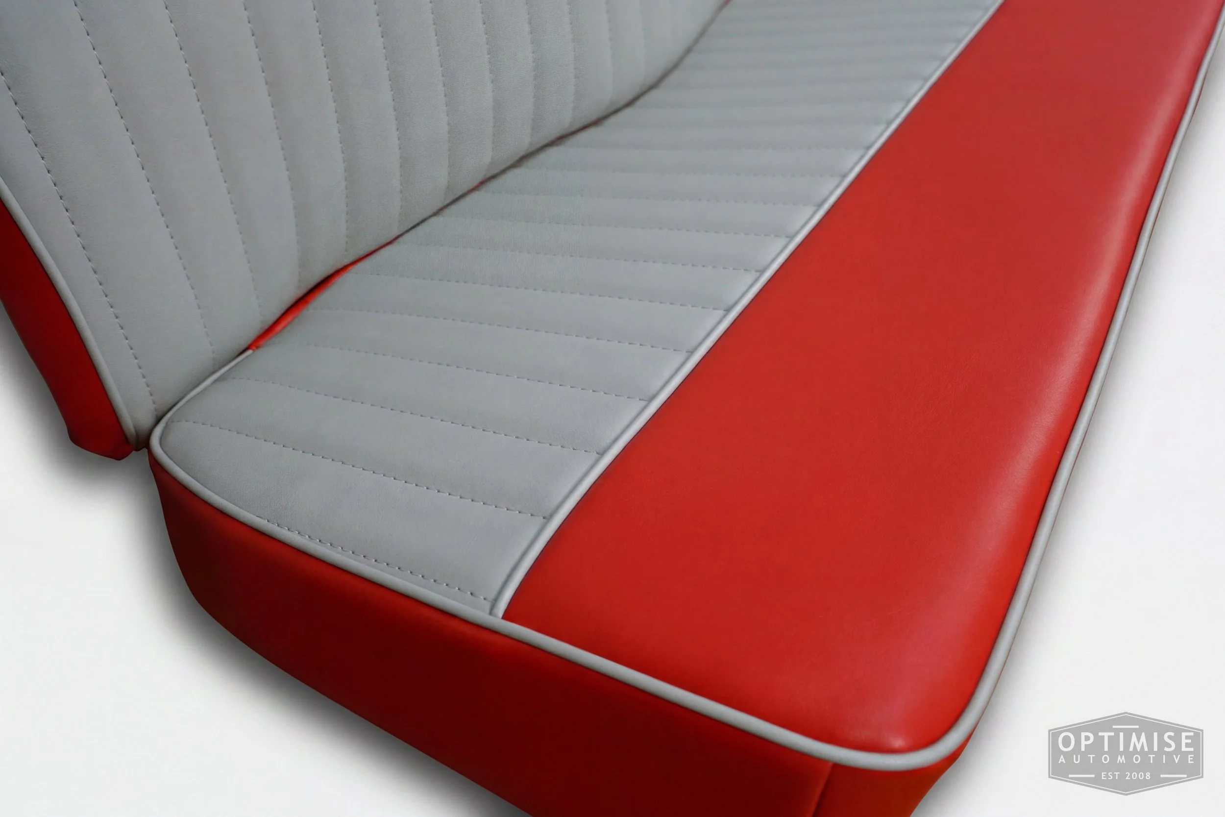 Classic Mini reclining seat retrims, trimmed in red and light grey vinyl leatherette.