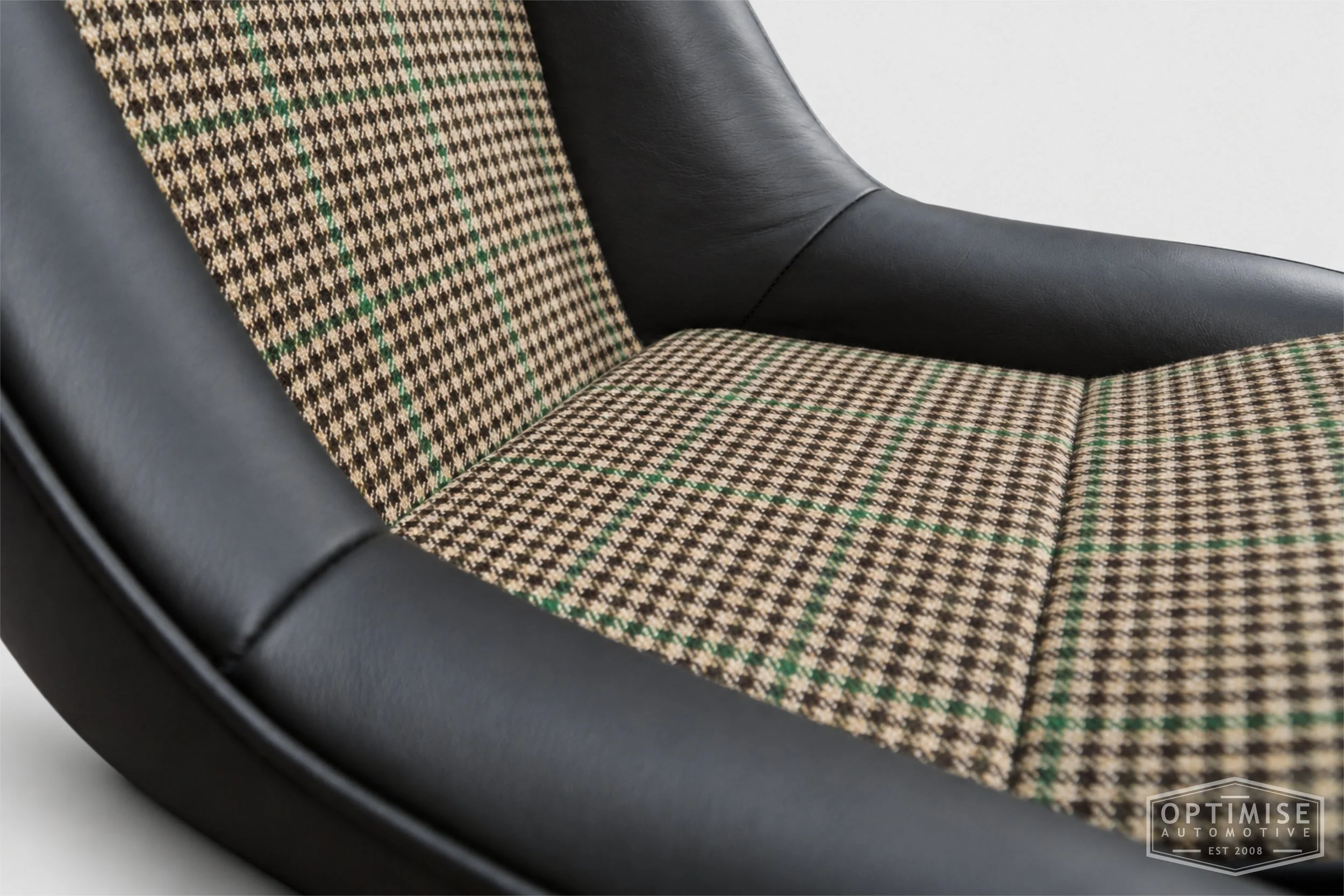 Classic Mini seat retrims featuring Cobra Cub front seats and a matching SPi rear seat, trimmed in Hampton Check Tweed 054 and Crest Vele black leather.