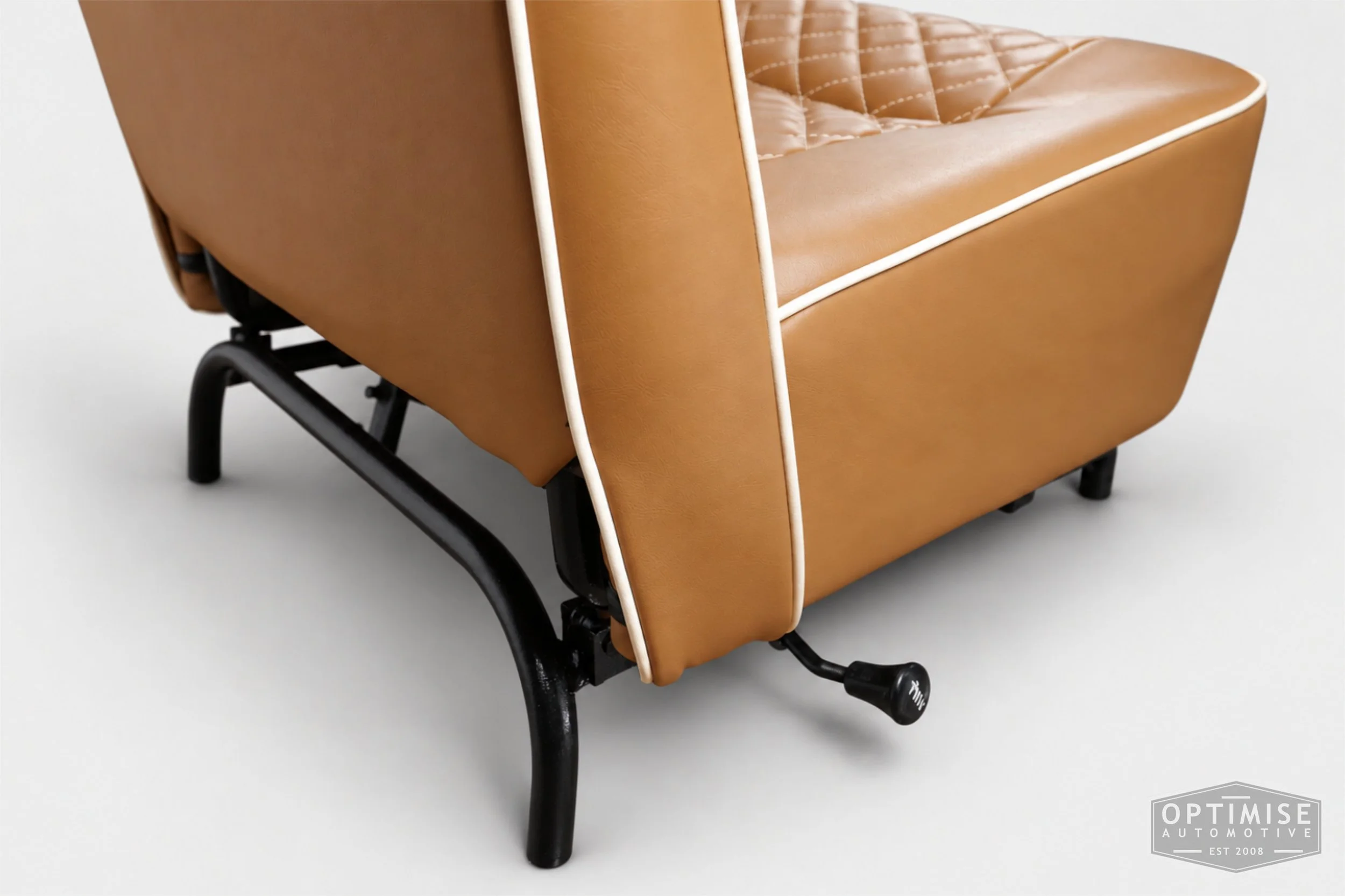Classic Mini seat retrims featuring original early MK3 vertical-leg non-reclining front seats and a matching early MK3 rear seat, trimmed in tan leatherette with cream diamond stitching and piping.