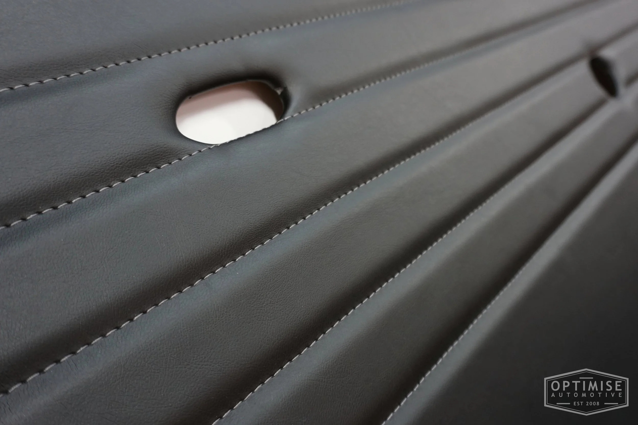 Classic Mini Monte-Carlo door cards, trimmed in black vinyl leatherette with dark grey stitching.
