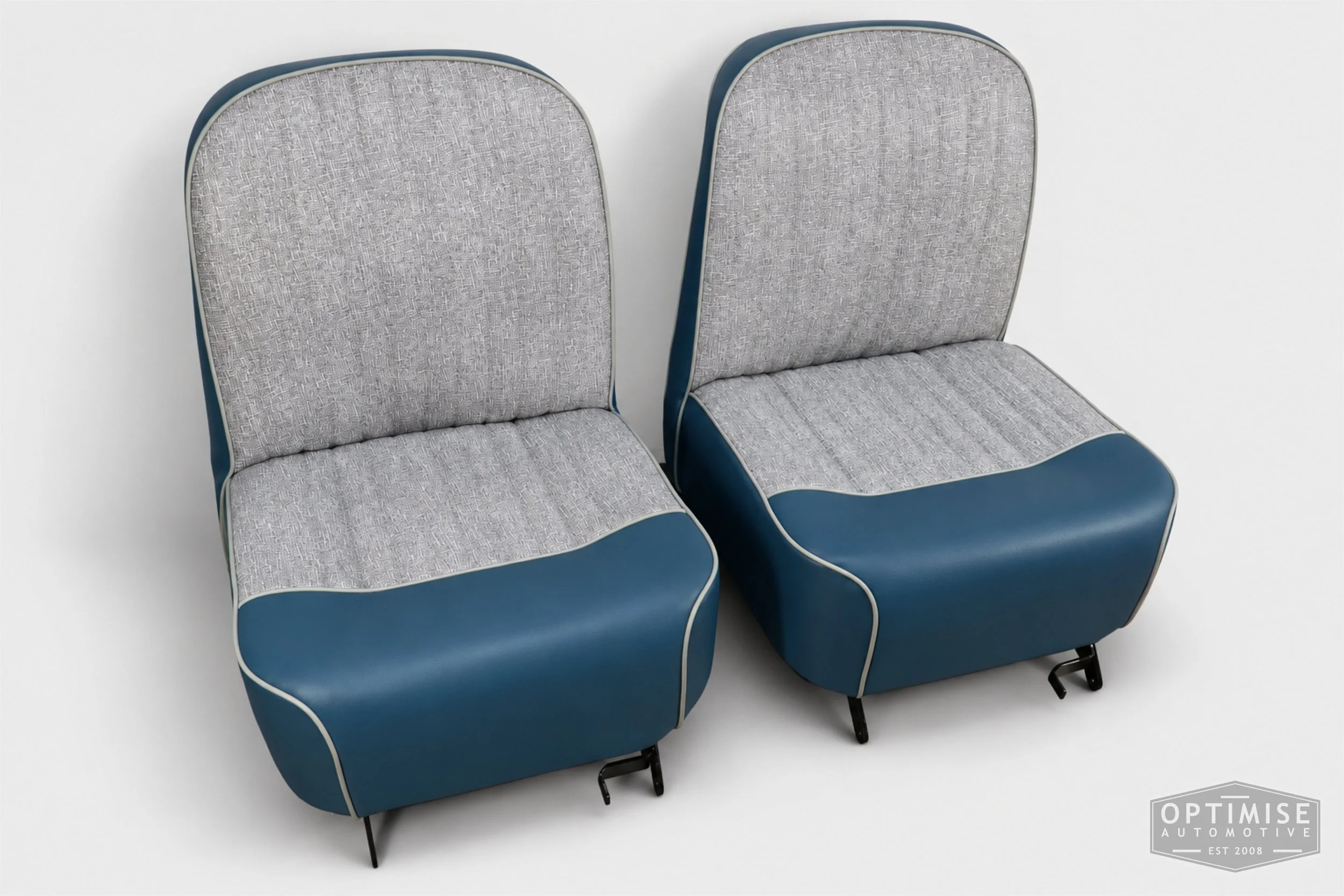 Classic Mini seat retrims featuring original non-reclining front seats and a matching MK1 rear seat, trimmed to original specifications in grey fleck and blue.