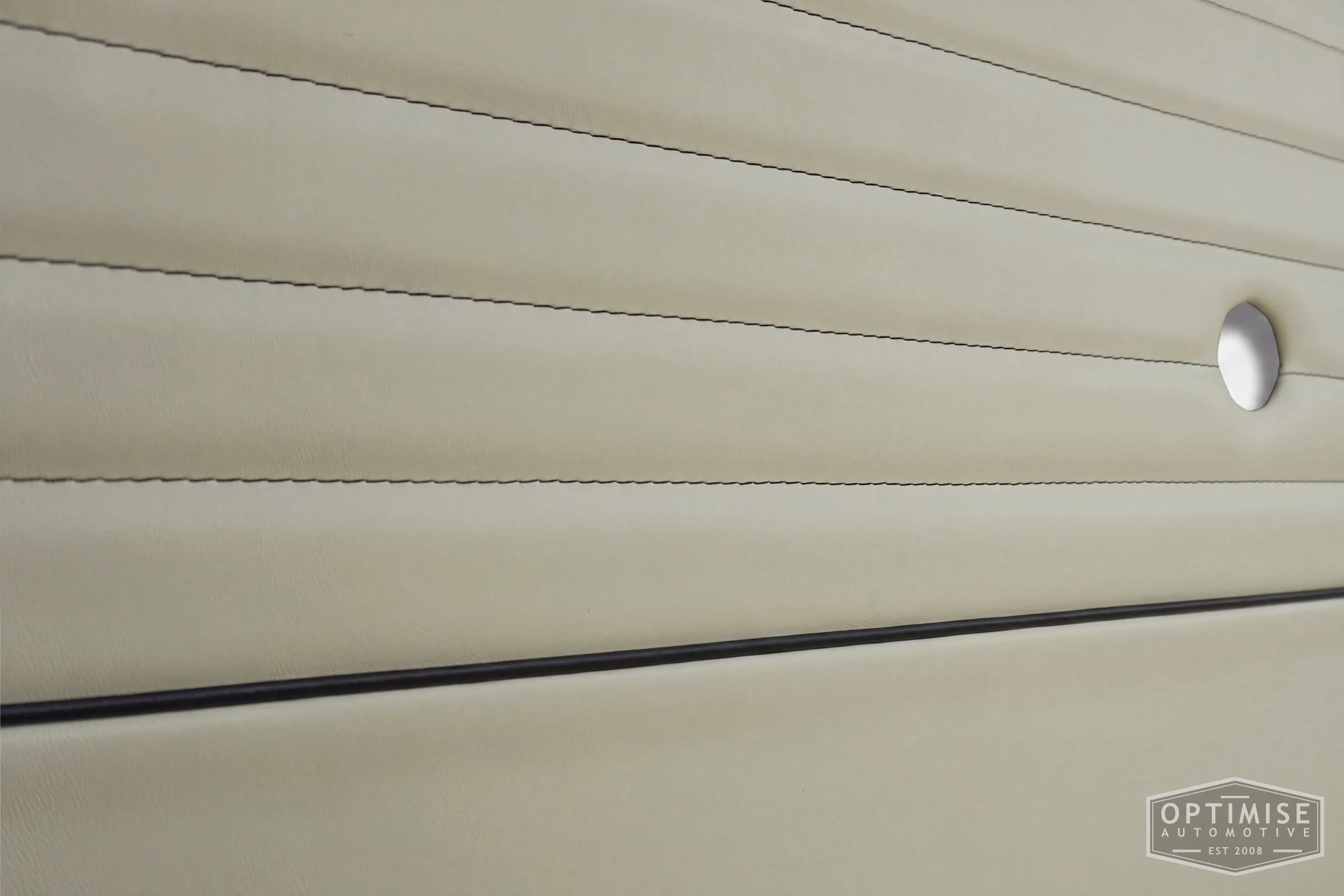 Classic Mini Monte-Carlo Plus door cards, trimmed in cream leatherette with dark green piping & stitching.