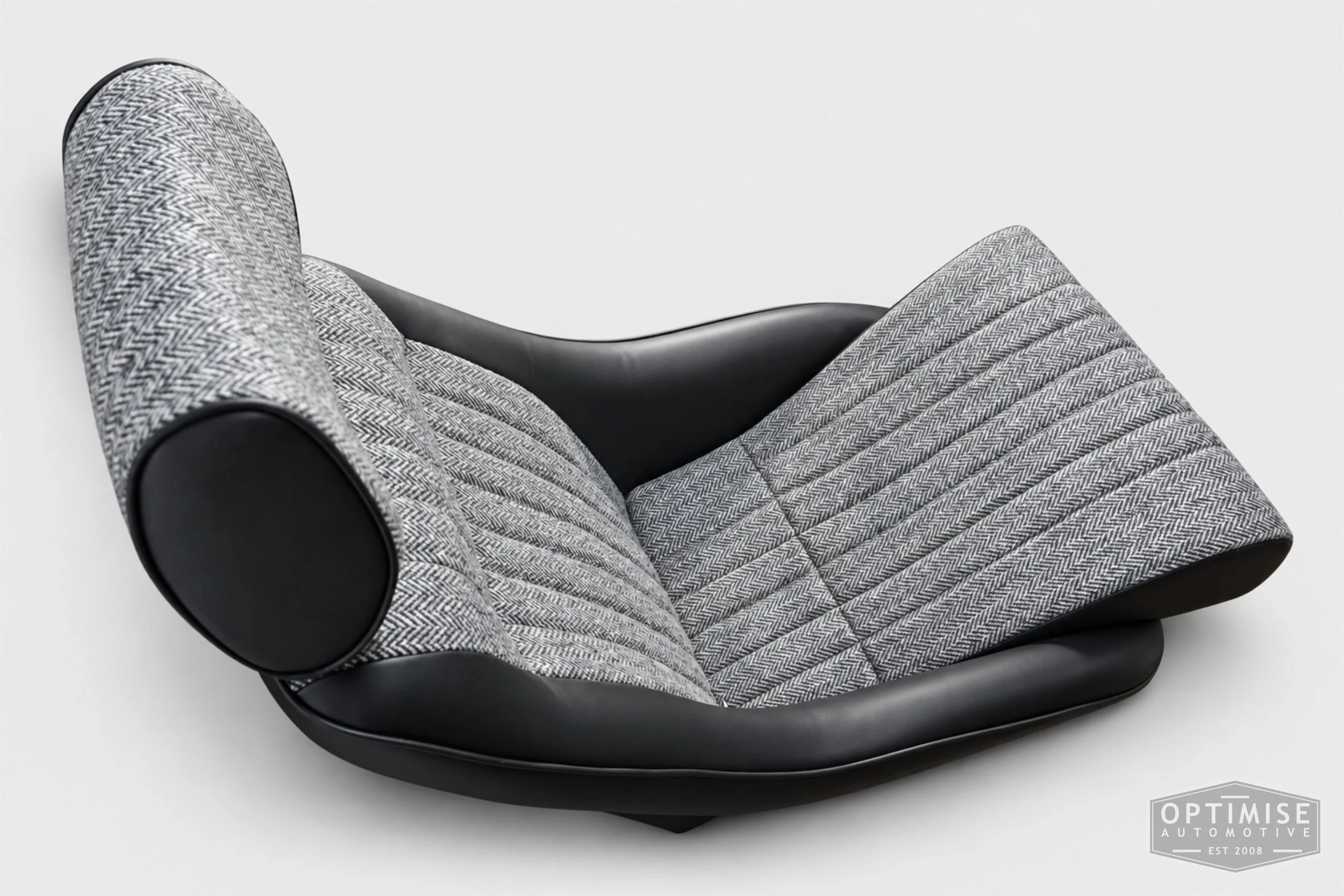 Classic Mini seat retrims featuring Cobra Monte Carlo front seats, trimmed in black leatherette and Harris Tweed HB1.
