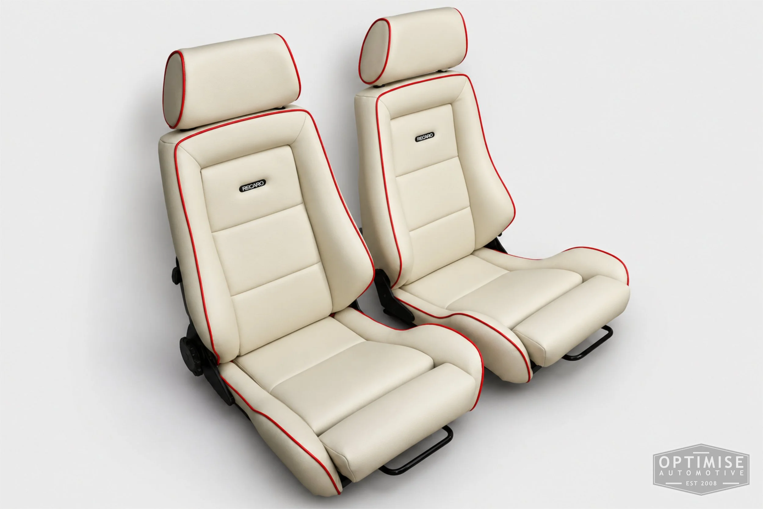 Classic Mini seat retrims featuring legendary RS Turbo Recaro front seats and a matching MK5 rear seat, trimmed in cream leatherette with red piping.