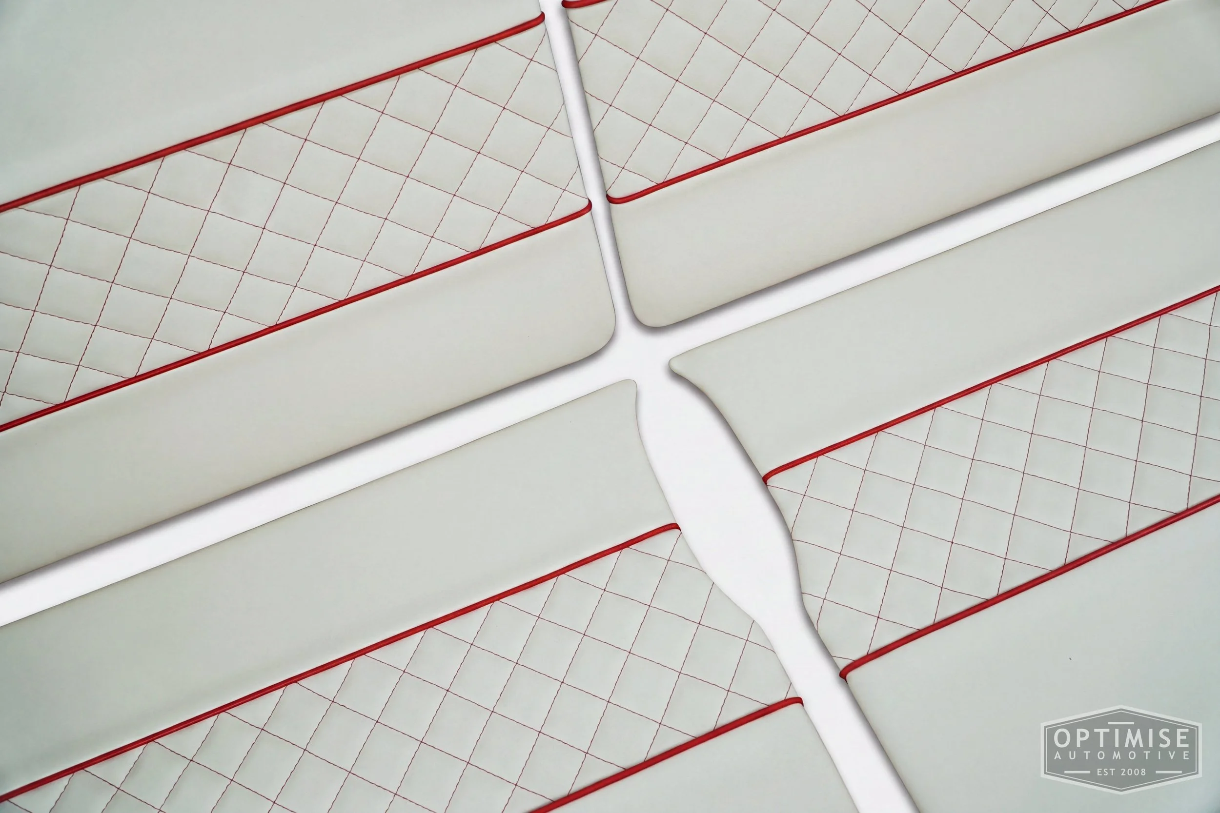 Classic Mini Wide-Stripe Fluted door cards, trimmed in cream vinyl leatherette with red piping & diamond stitching.