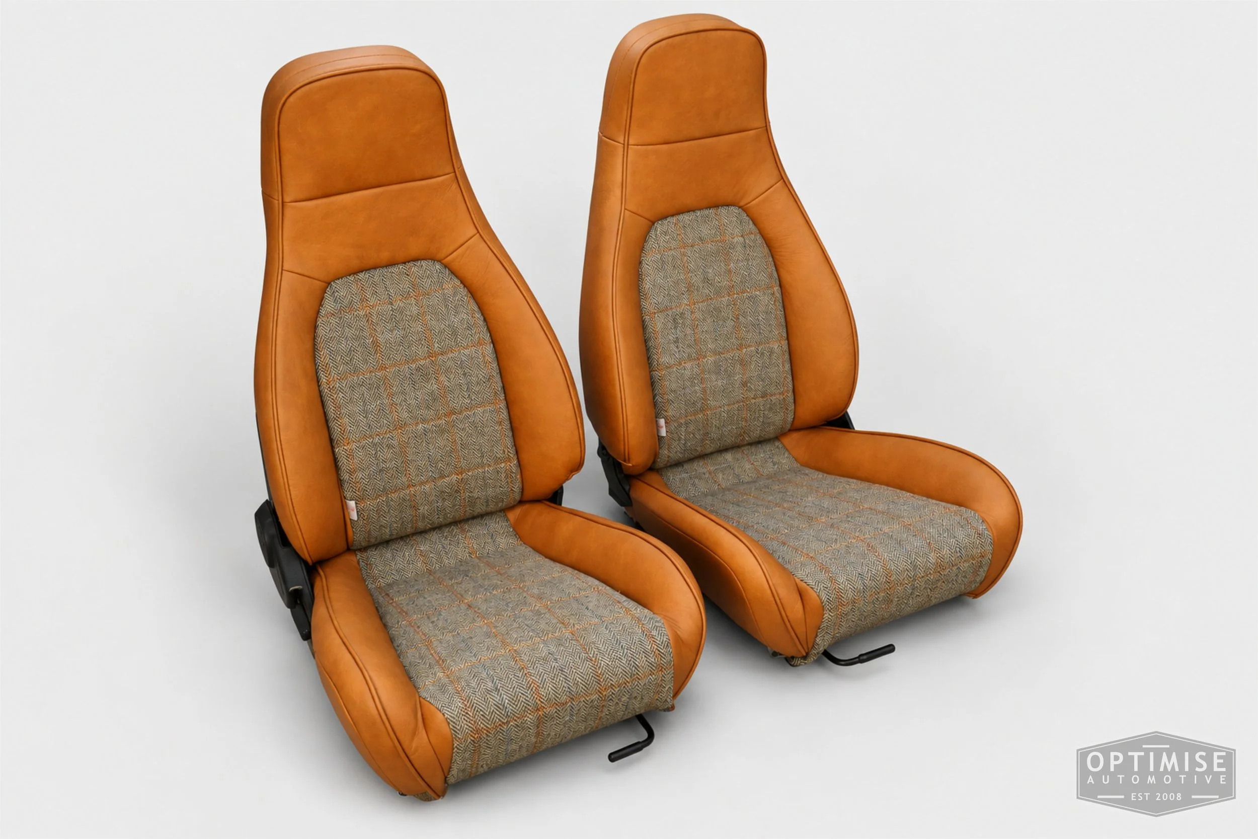 Classic Mini seat retrims featuring Mazda MX-5 front seats and a matching early MK3 rear seat, trimmed in Harris Tweed HB133 and Crest Austen ochre leather.