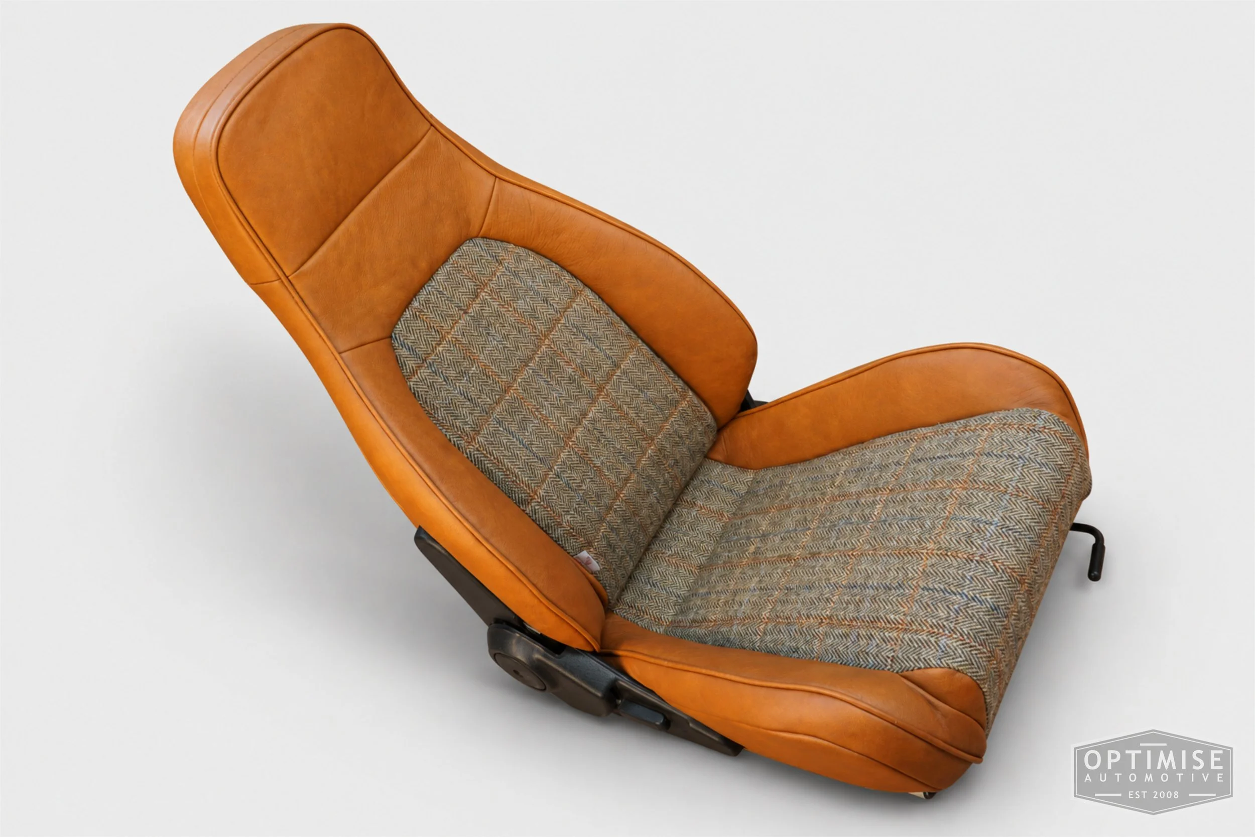 Classic Mini seat retrims featuring Mazda MX-5 front seats and a matching early MK3 rear seat, trimmed in Harris Tweed HB133 and Crest Austen ochre leather.
