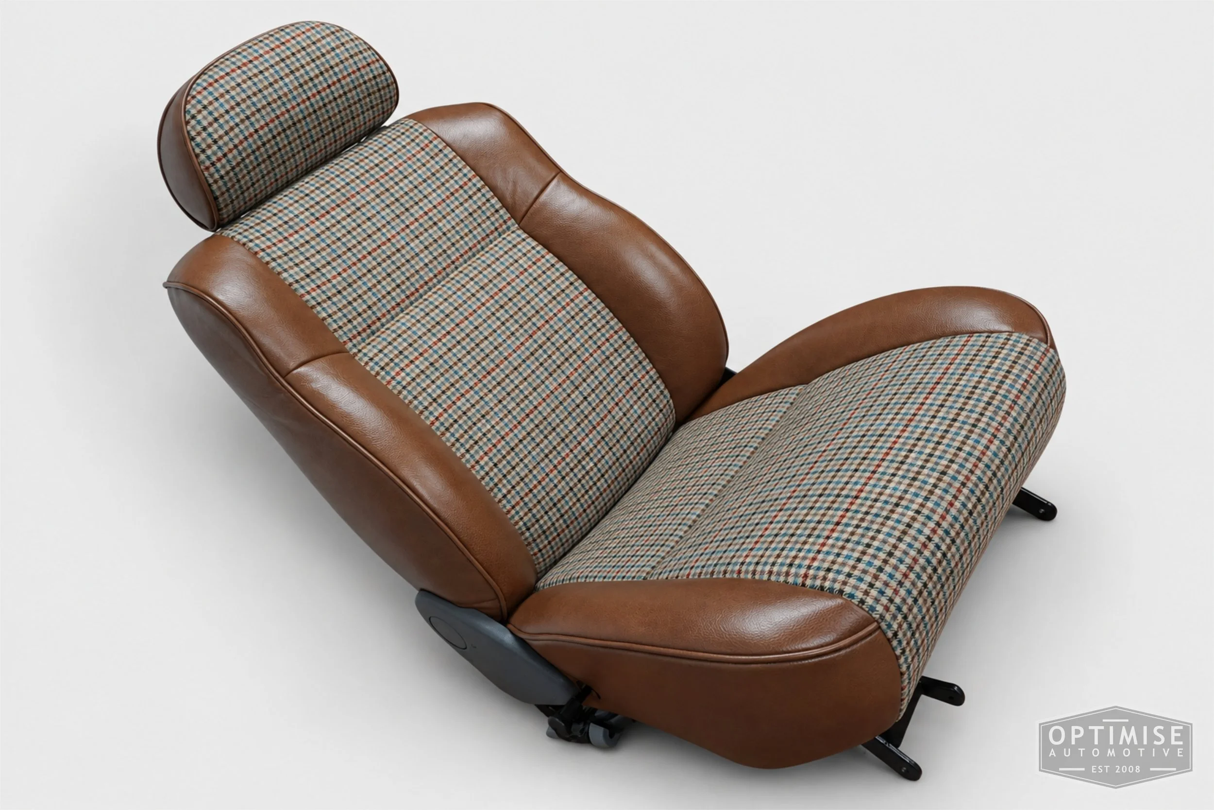 Classic Mini seat retrims featuring original SPi front seats and a matching rear seat, trimmed in Crest Cambridge lark leather and Ashdown Check fabric 145.