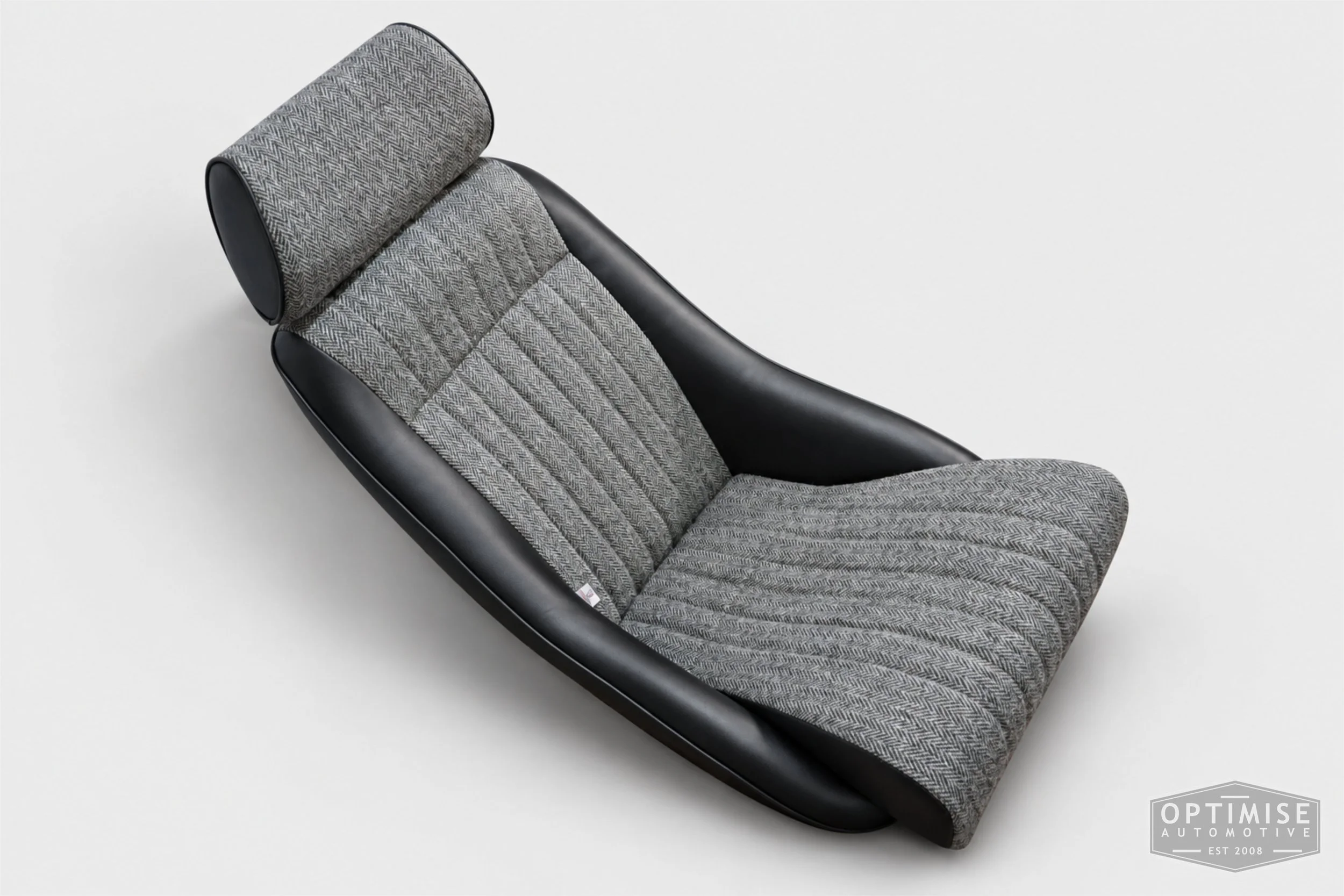 Classic Mini seat retrims featuring Cobra Monte Carlo front seats, trimmed in black leatherette and Harris Tweed HB1.