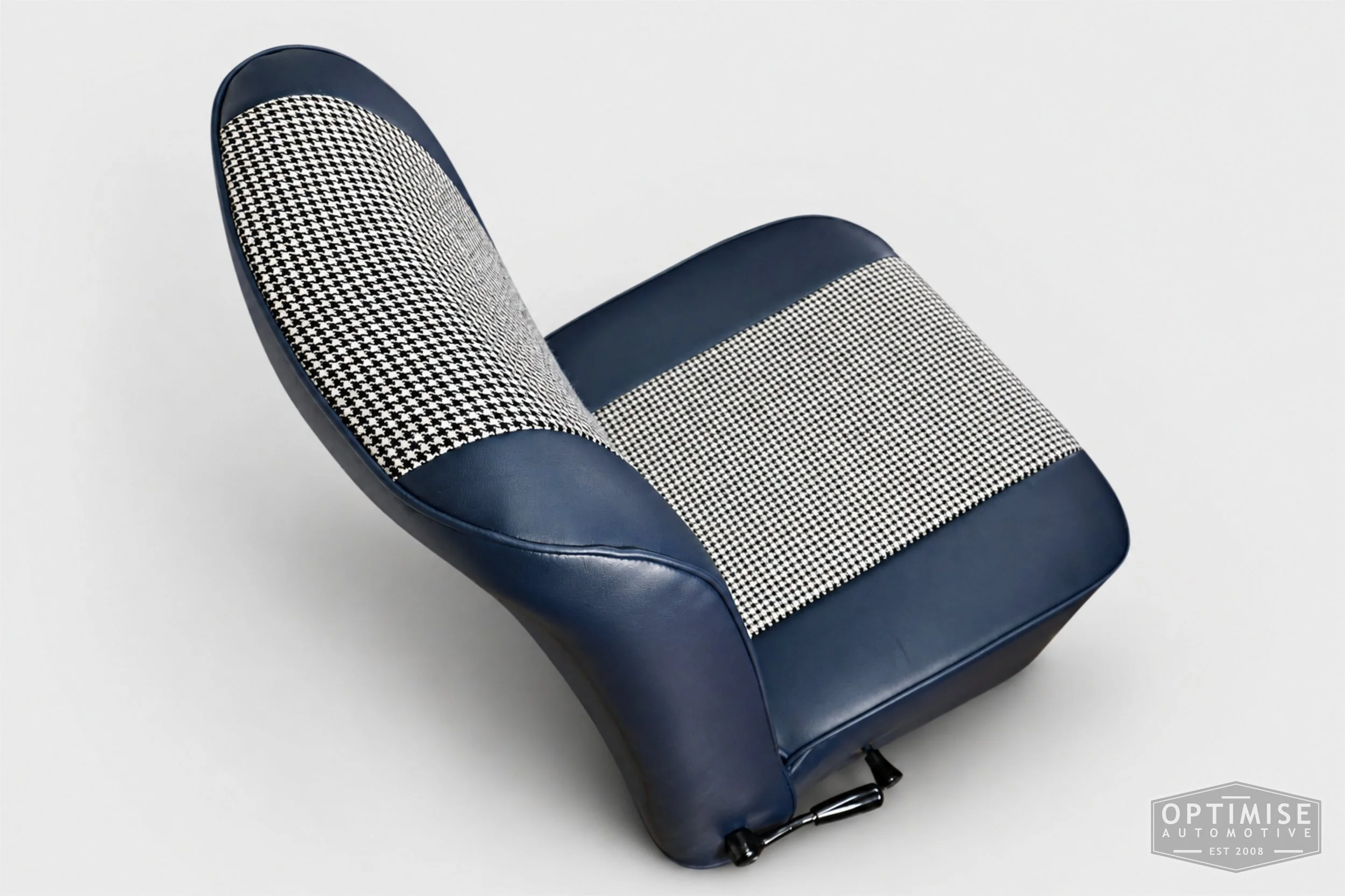 Classic Mini seat retrims featuring original reclining front seats and a matching rear seat, trimmed to original specifications in Mayfair black & white houndstooth cloth and midnight blue leatherette.