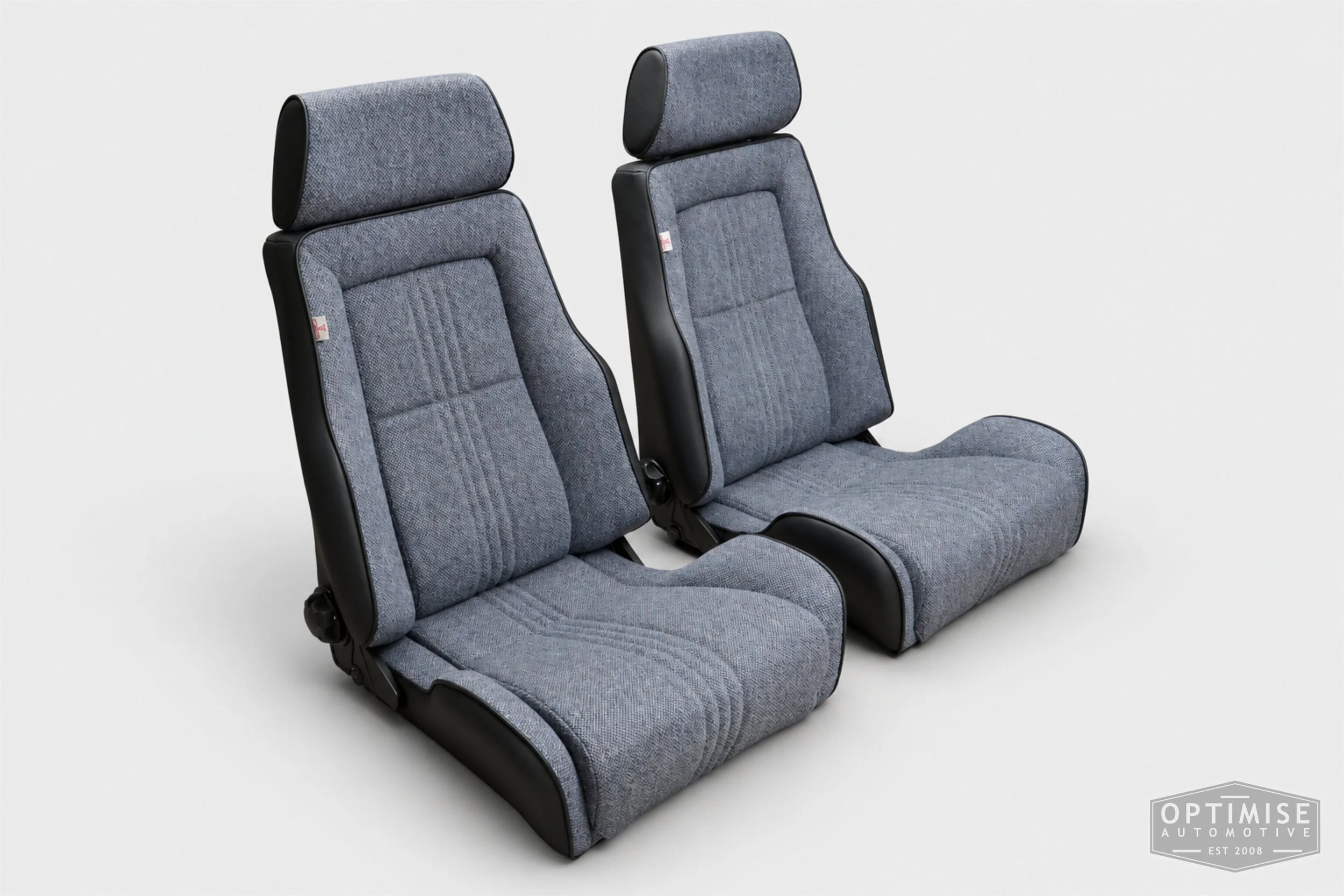 Classic Mini seat retrims featuring Cobra Le Mans front seats and a matching MK6 rear seat, trimmed in black leatherette and Harris Tweed blue Barleycorn BC1.