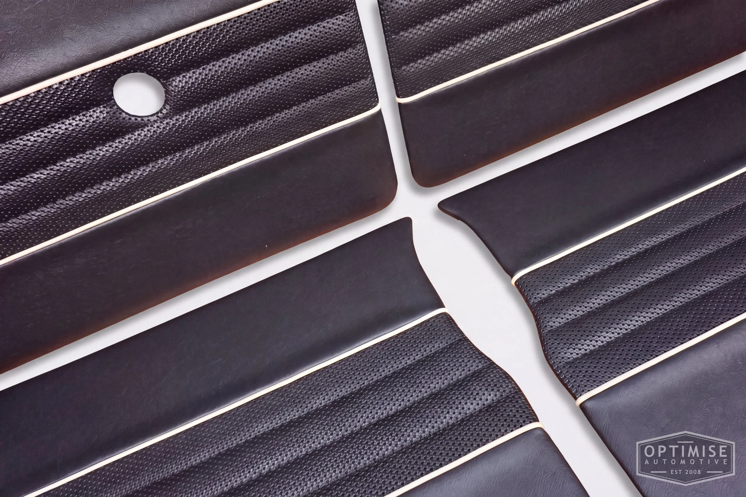 Classic Mini Wide-Stripe Fluted door cards, trimmed in black vinyl leatherette and black basketweave with cream piping & black stitching.