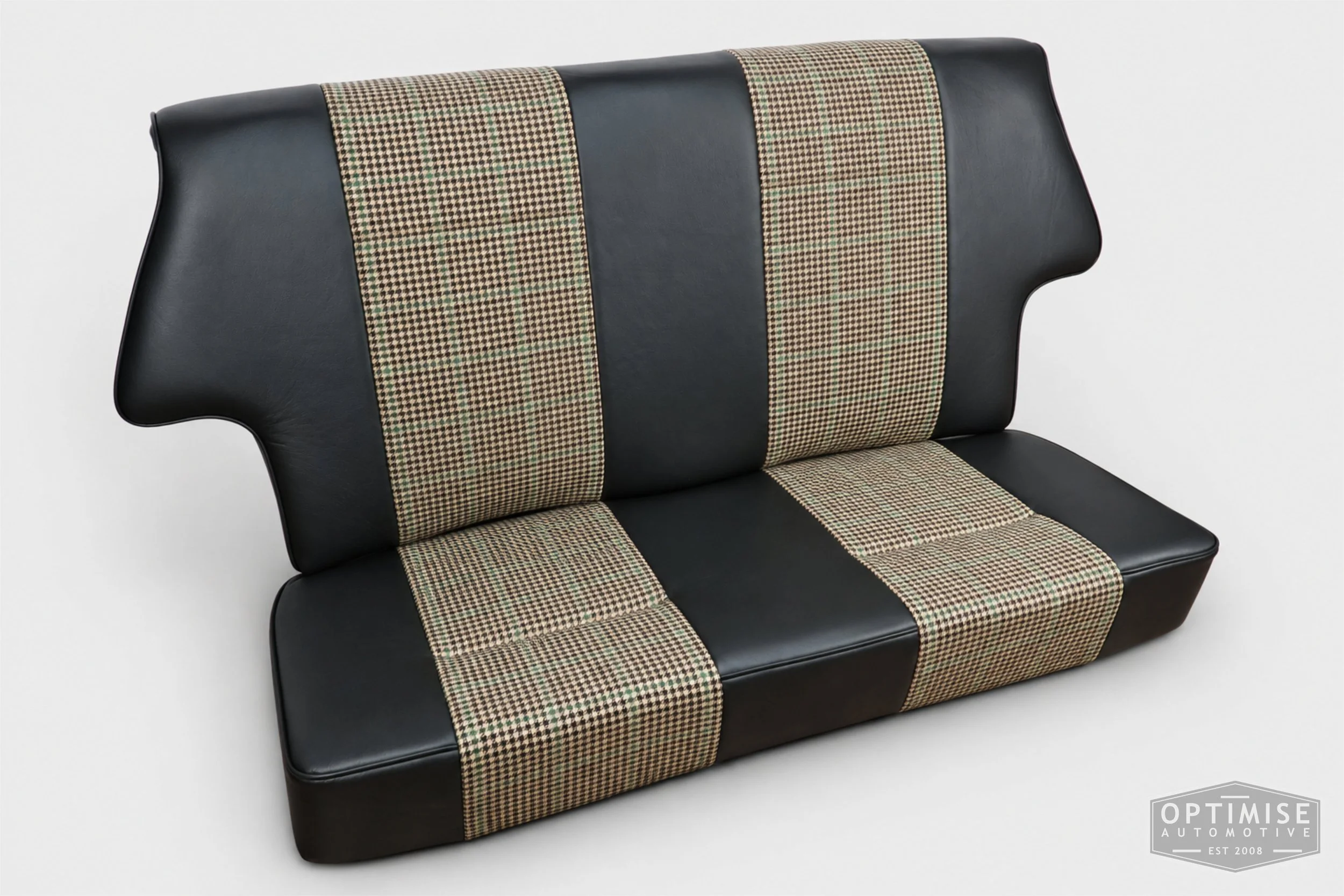 Classic Mini seat retrims featuring Cobra Cub front seats and a matching SPi rear seat, trimmed in Hampton Check Tweed 054 and Crest Vele black leather.
