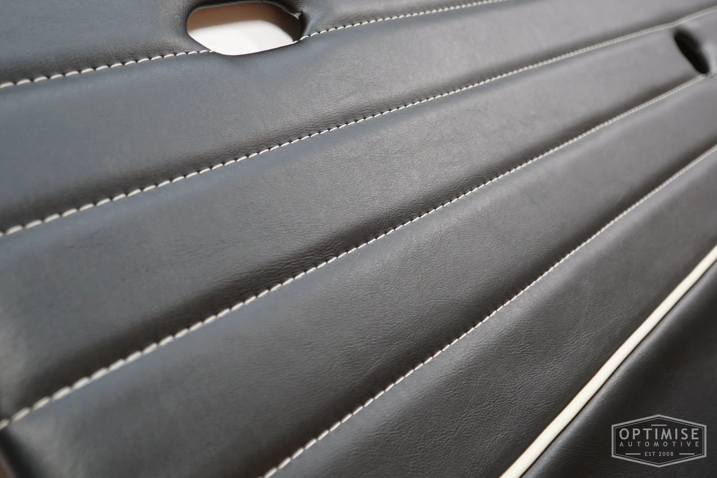 Classic Mini Monte-Carlo Plus door cards, trimmed in black vinyl leatherette with cream piping & stitching.