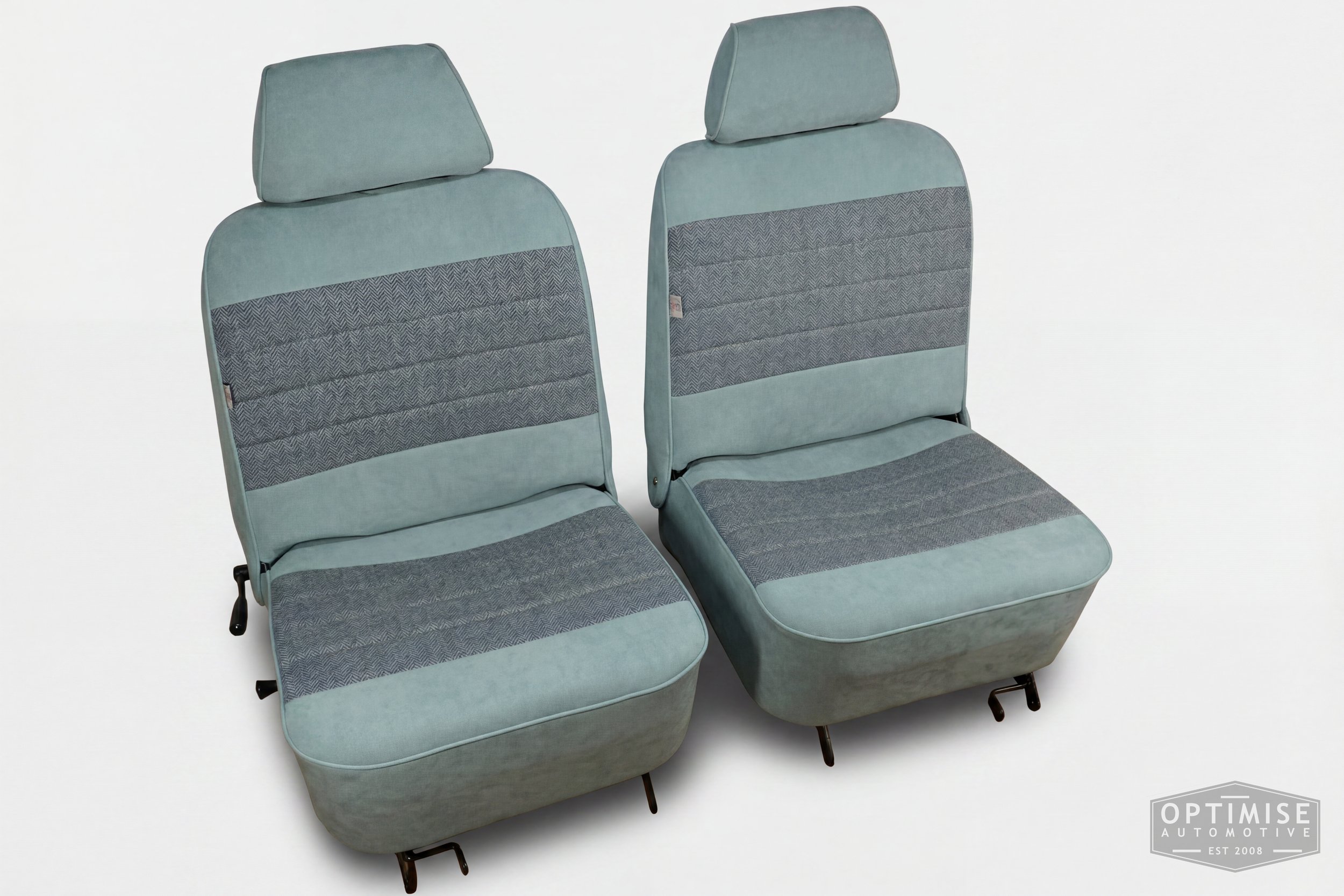 Classic Mini single post headrest seat retrims, trimmed in light blue Alcantara and Harris Tweed HB108.