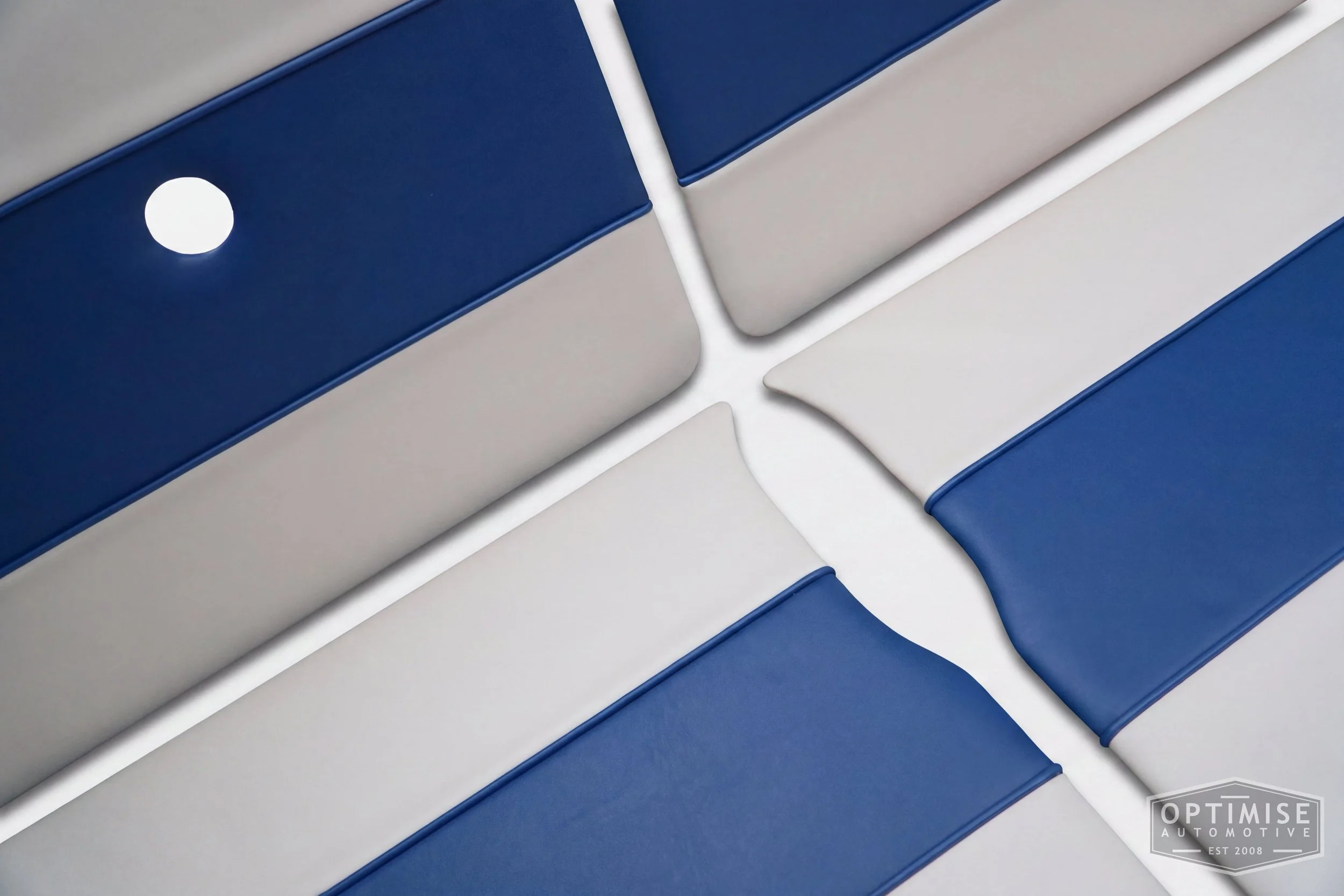 Classic Mini Wide-Stripe door cards, trimmed in cream and Royal blue vinyl leatherette with Royal blue piping.