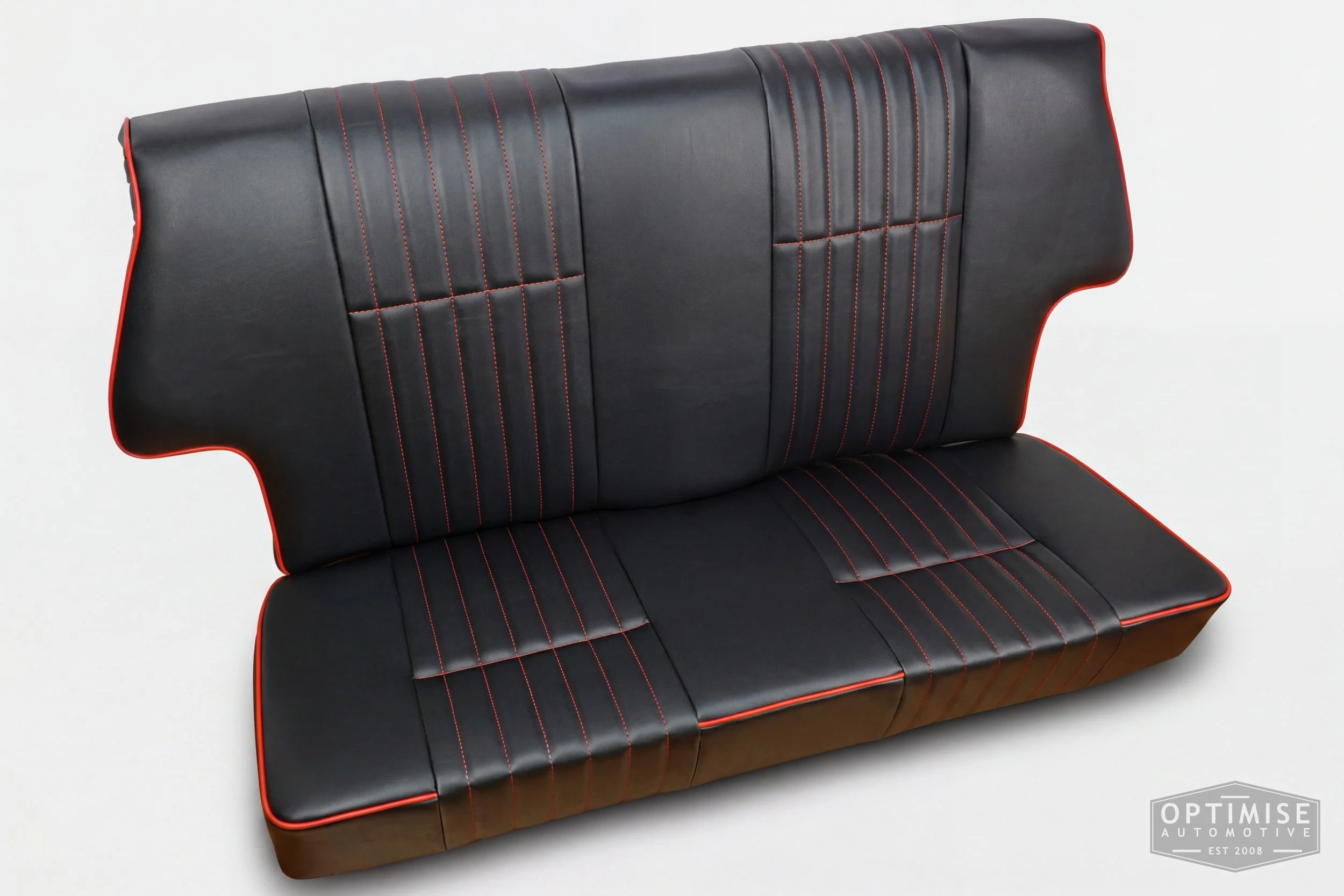 Classic Mini single post headrest seat retrims, trimmed in black leatherette with red piping and stitching.