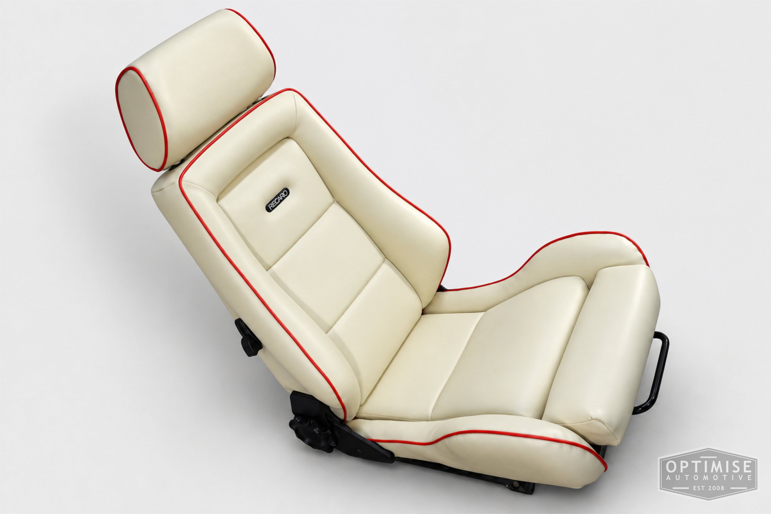 Classic Mini seat retrims featuring legendary RS Turbo Recaro front seats and a matching MK5 rear seat, trimmed in cream leatherette with red piping.