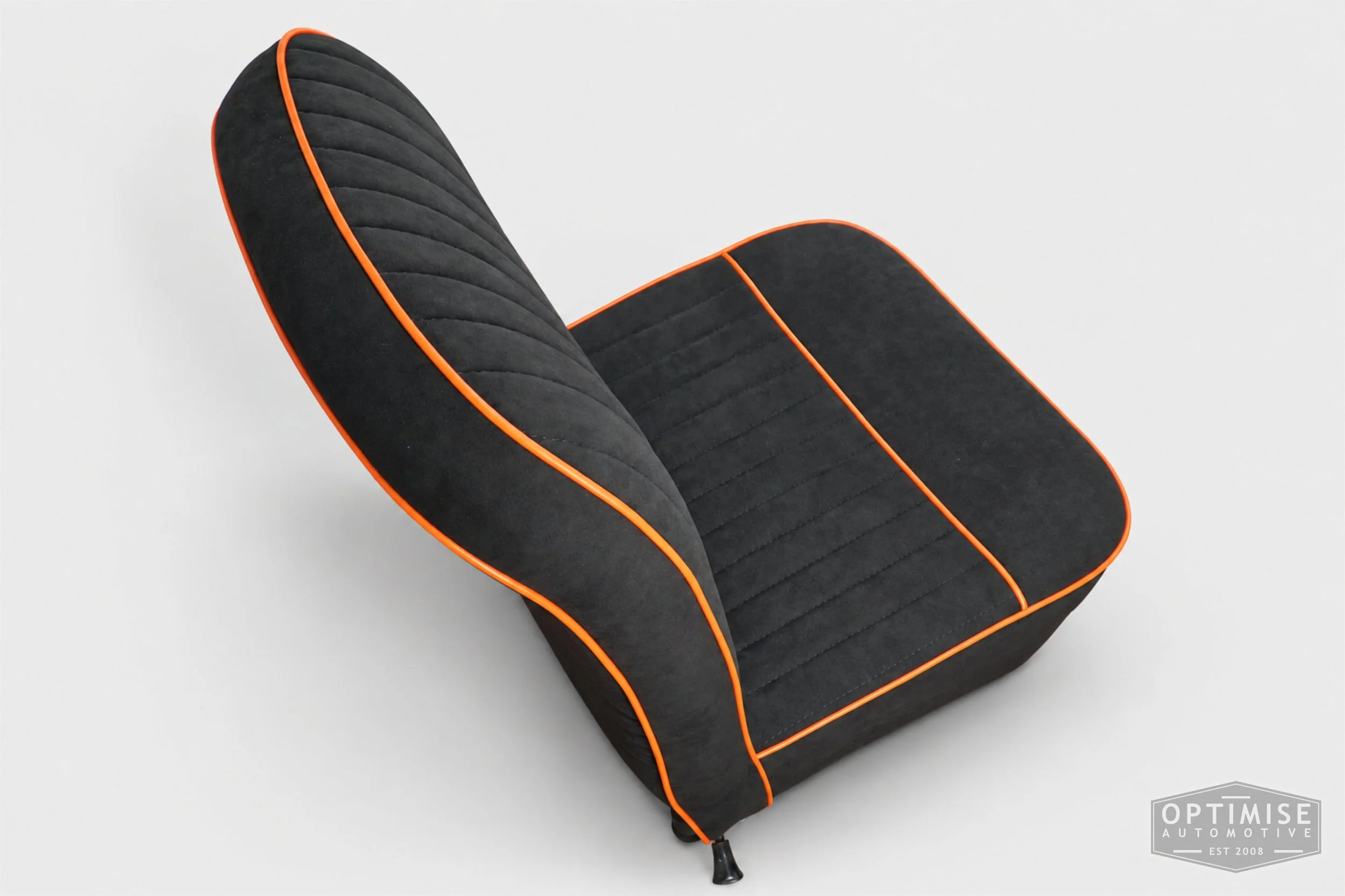 Classic Mini Van seat retrims featuring original non-reclining front seats, trimmed in black Alcantara with orange piping.