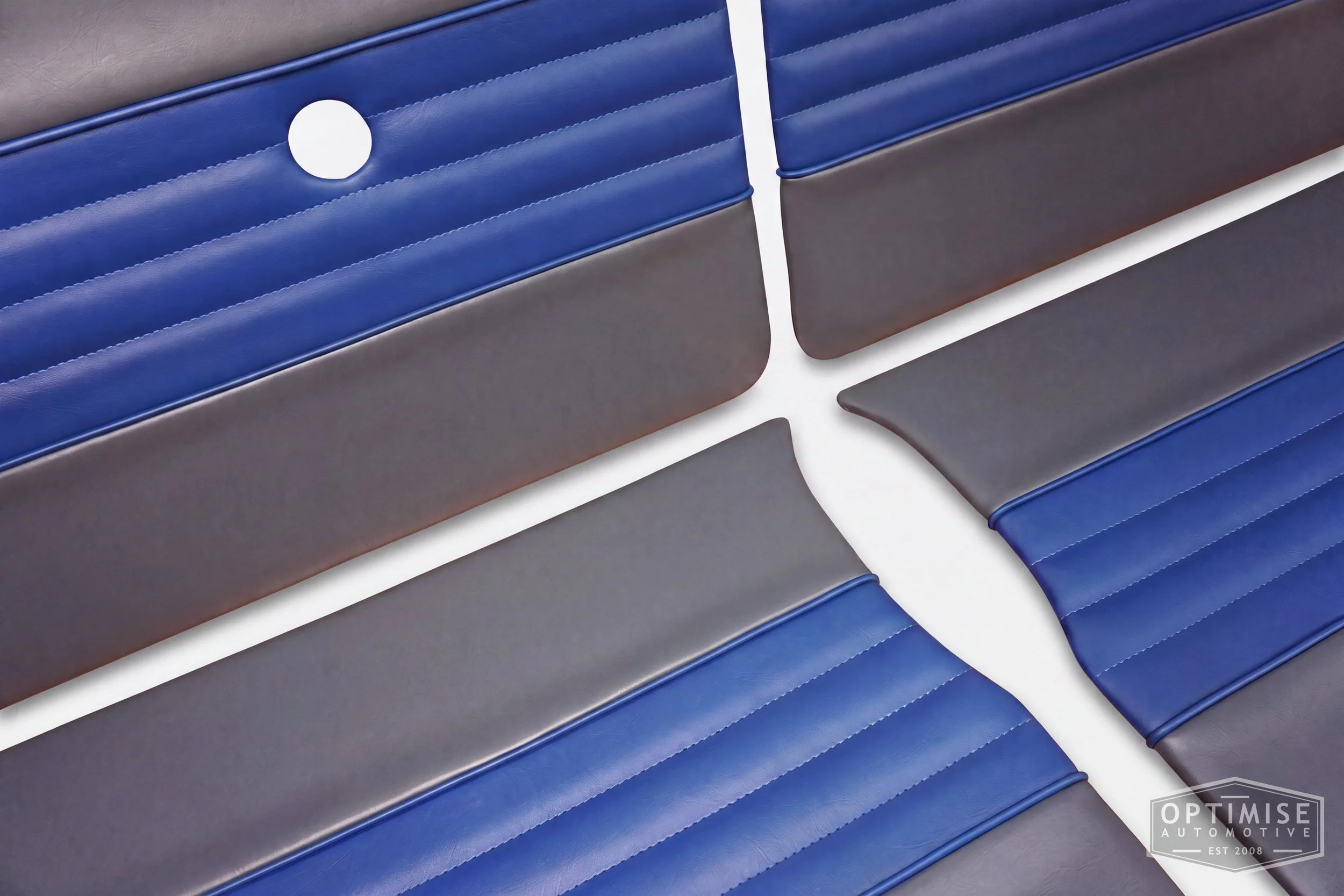 Classic Mini Wide-Stripe Fluted door cards, trimmed in dark grey and blue vinyl leatherette with blue piping & stitching.