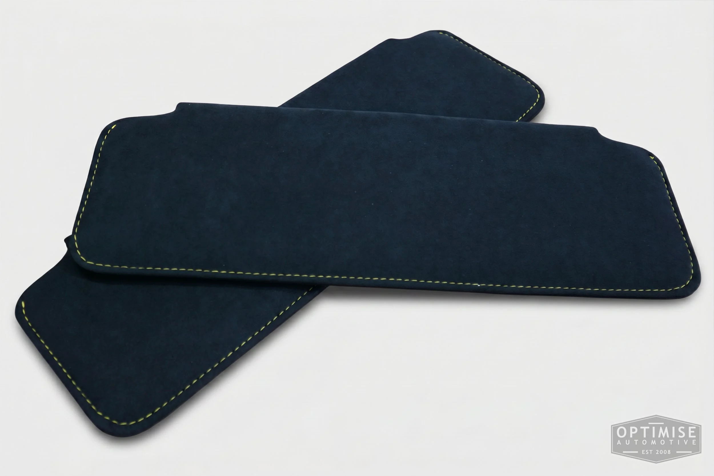 Classic Mini sun visor retrims, trimmed in black Alcantara with yellow stitching.