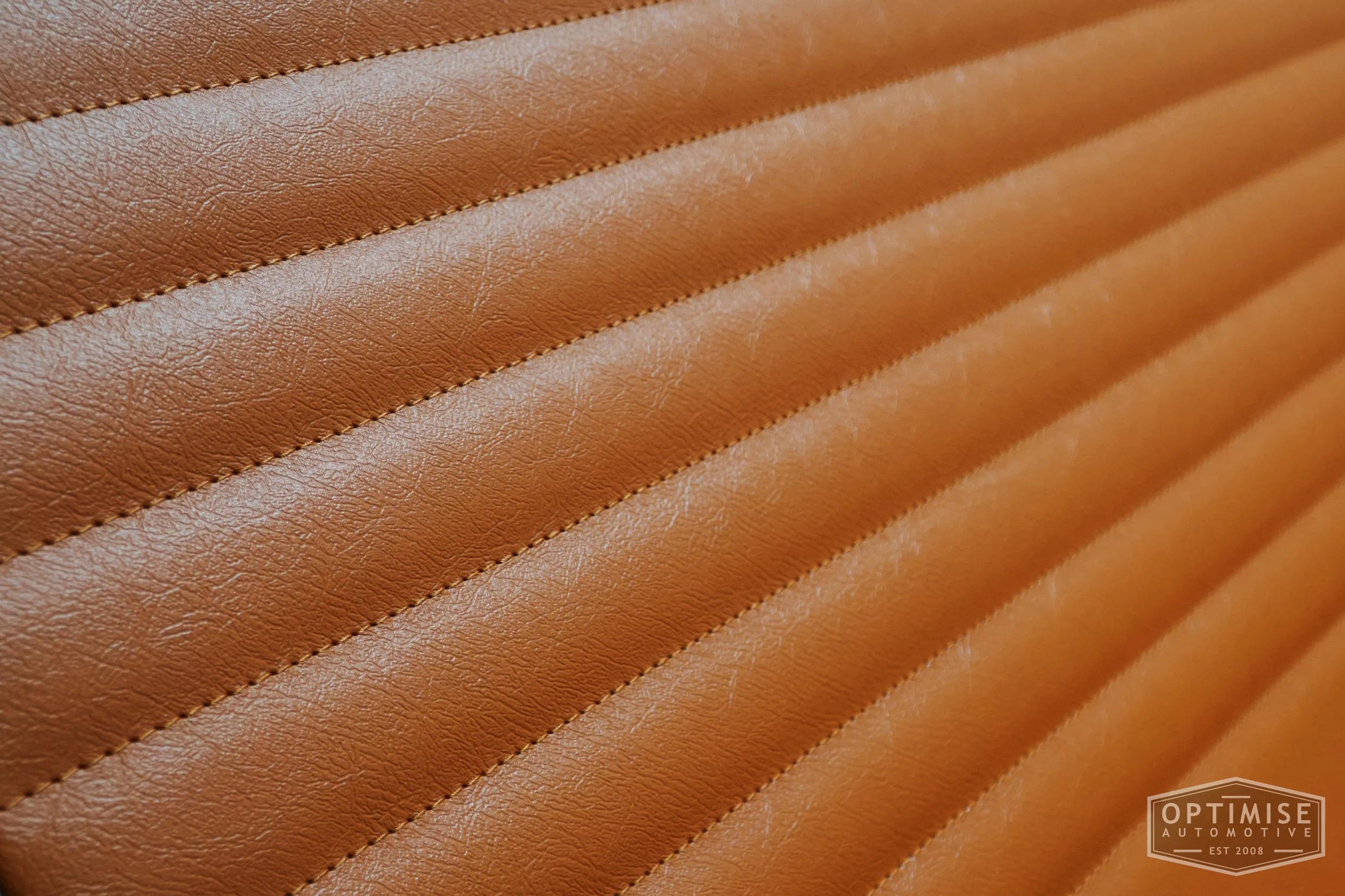 Classic Mini Monte-Carlo door cards, trimmed in Jaguar light tan vinyl leatherette with Jaguar light tan stitching.