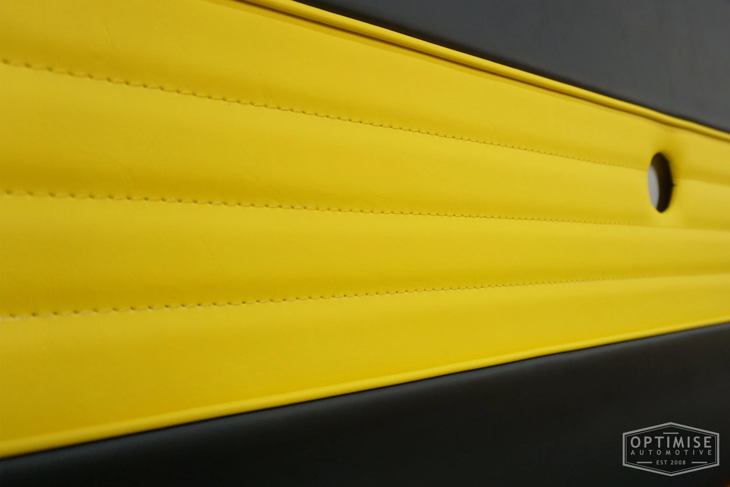 Classic Mini Wide-Stripe Fluted door cards, trimmed in black and yellow vinyl leatherette with yellow piping & stitching.